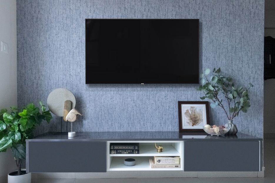 Blue Textured Living Room Wallpaper With Golden Sconce  Livspace