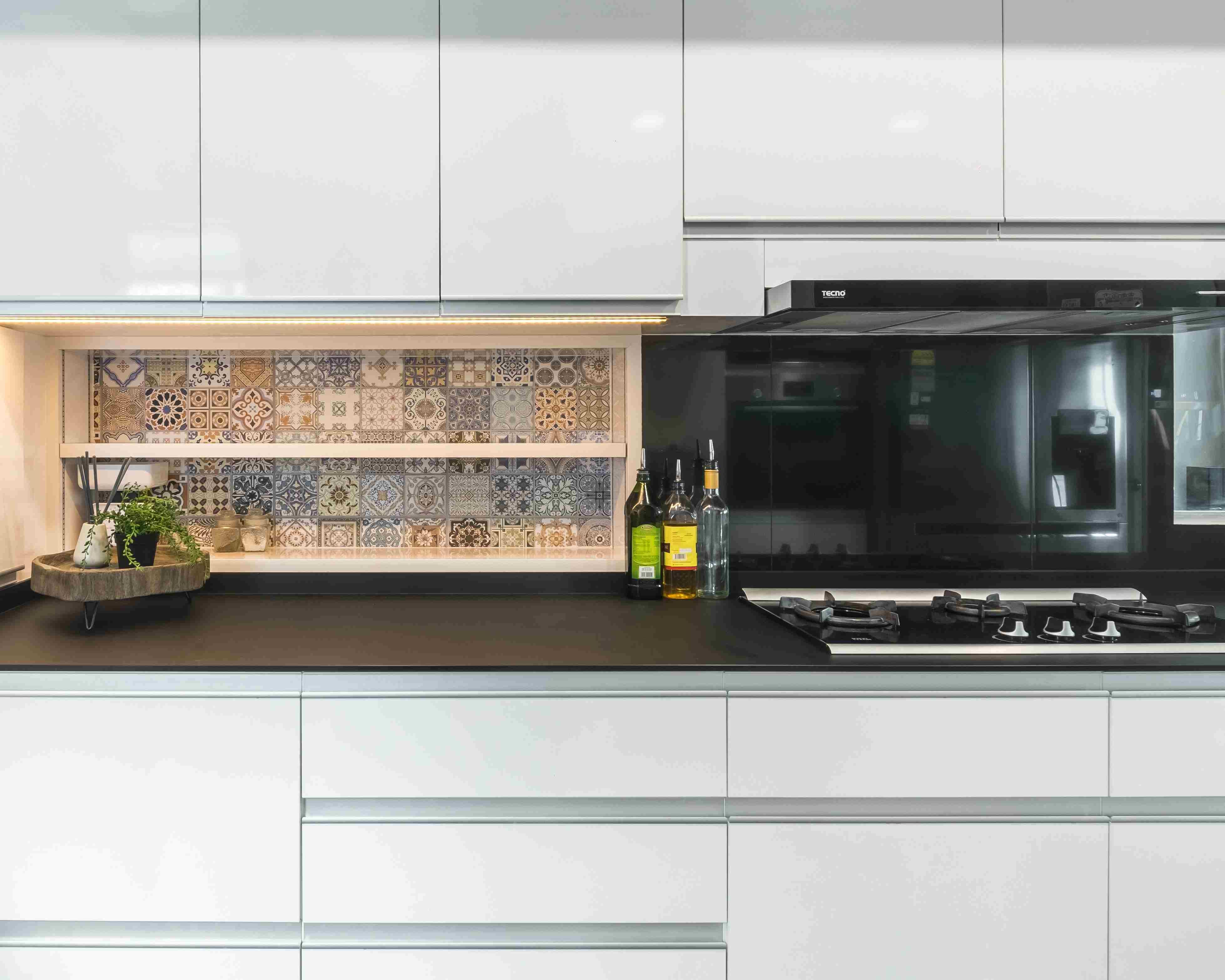 trendy black and patterned tiles design for kitchen backsplash