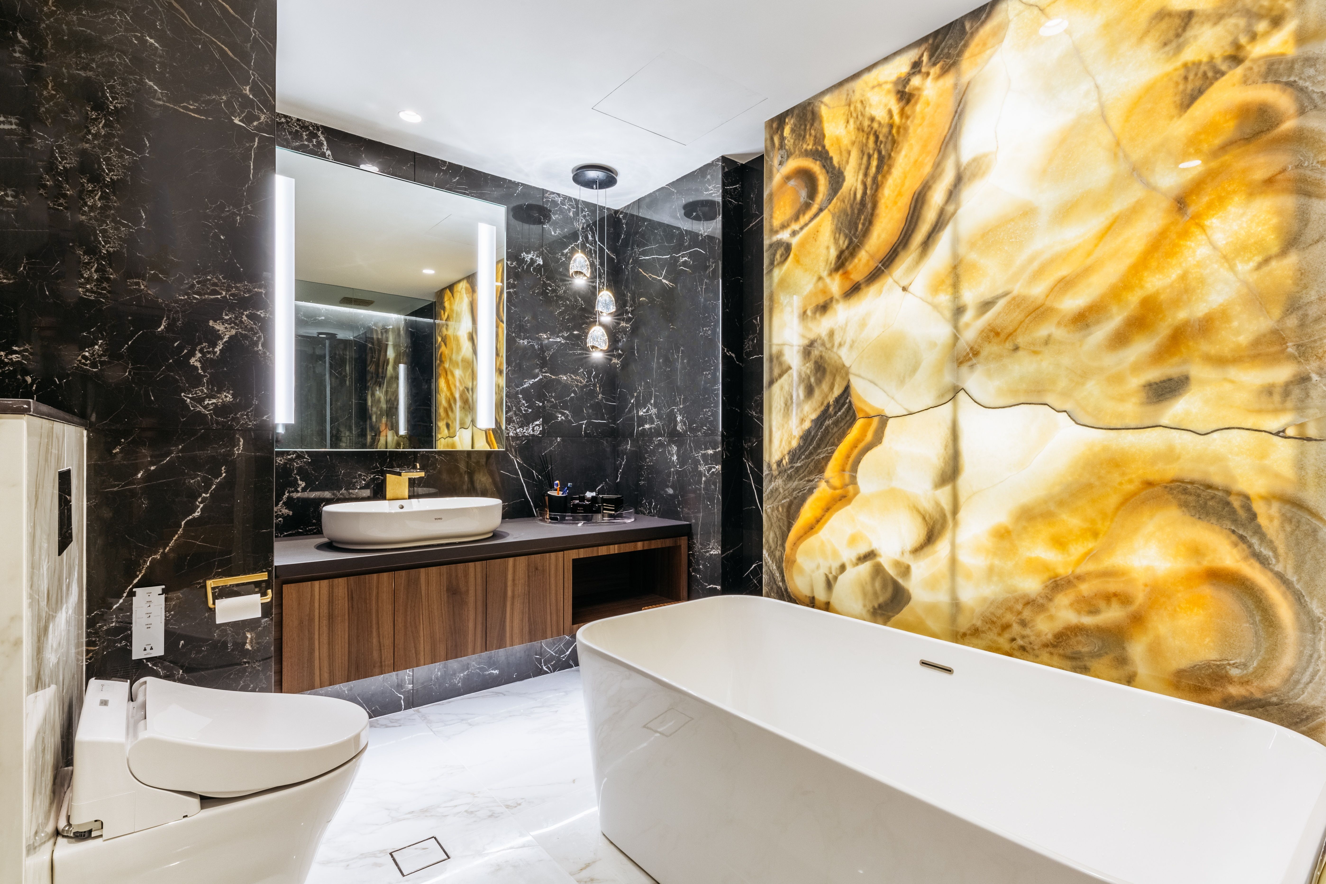 Black Marble Walls And Golden Yellow With A Tint Of Brown Marble Splash