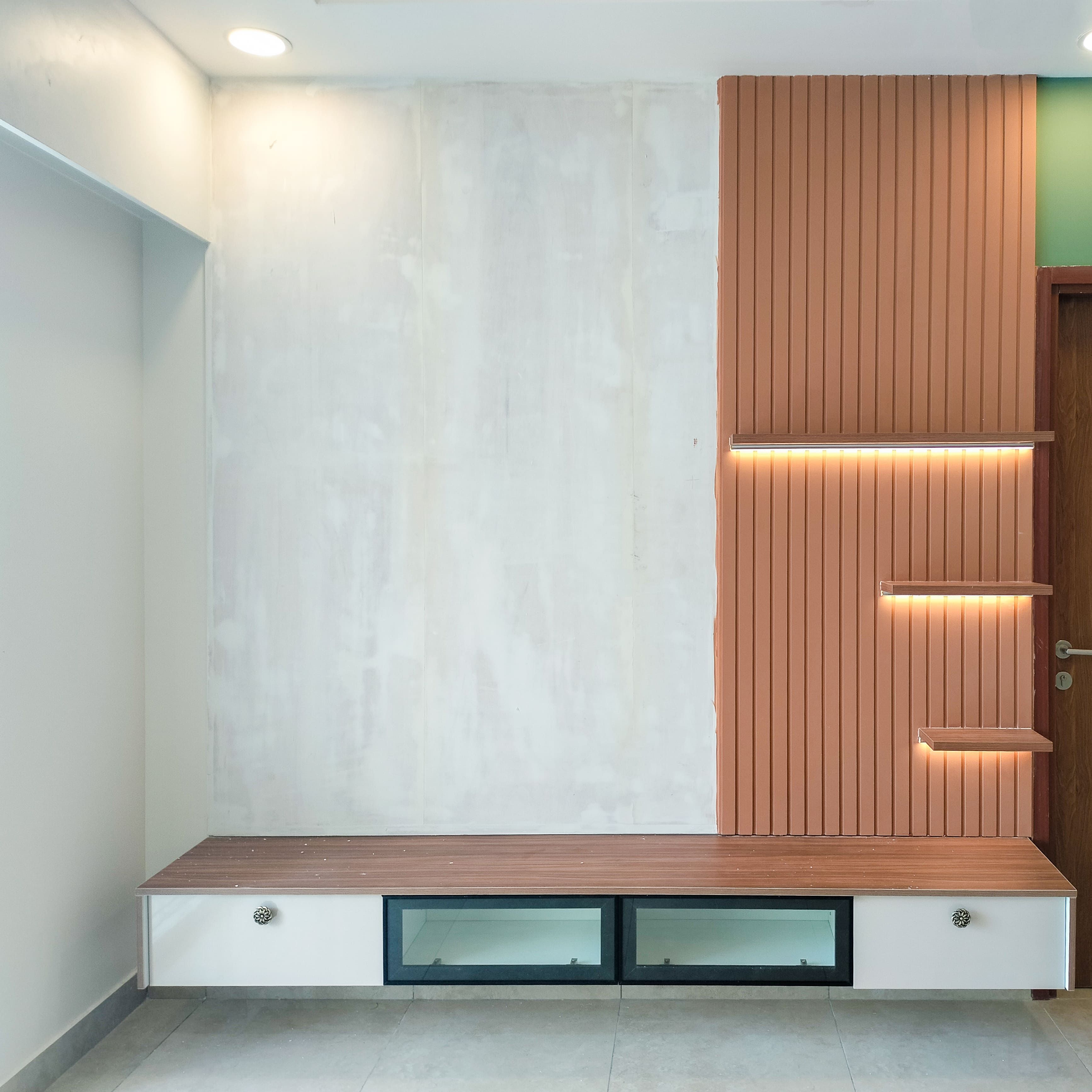 TV Unit Design with wooden Slats Wall Backsplash and White Drawers