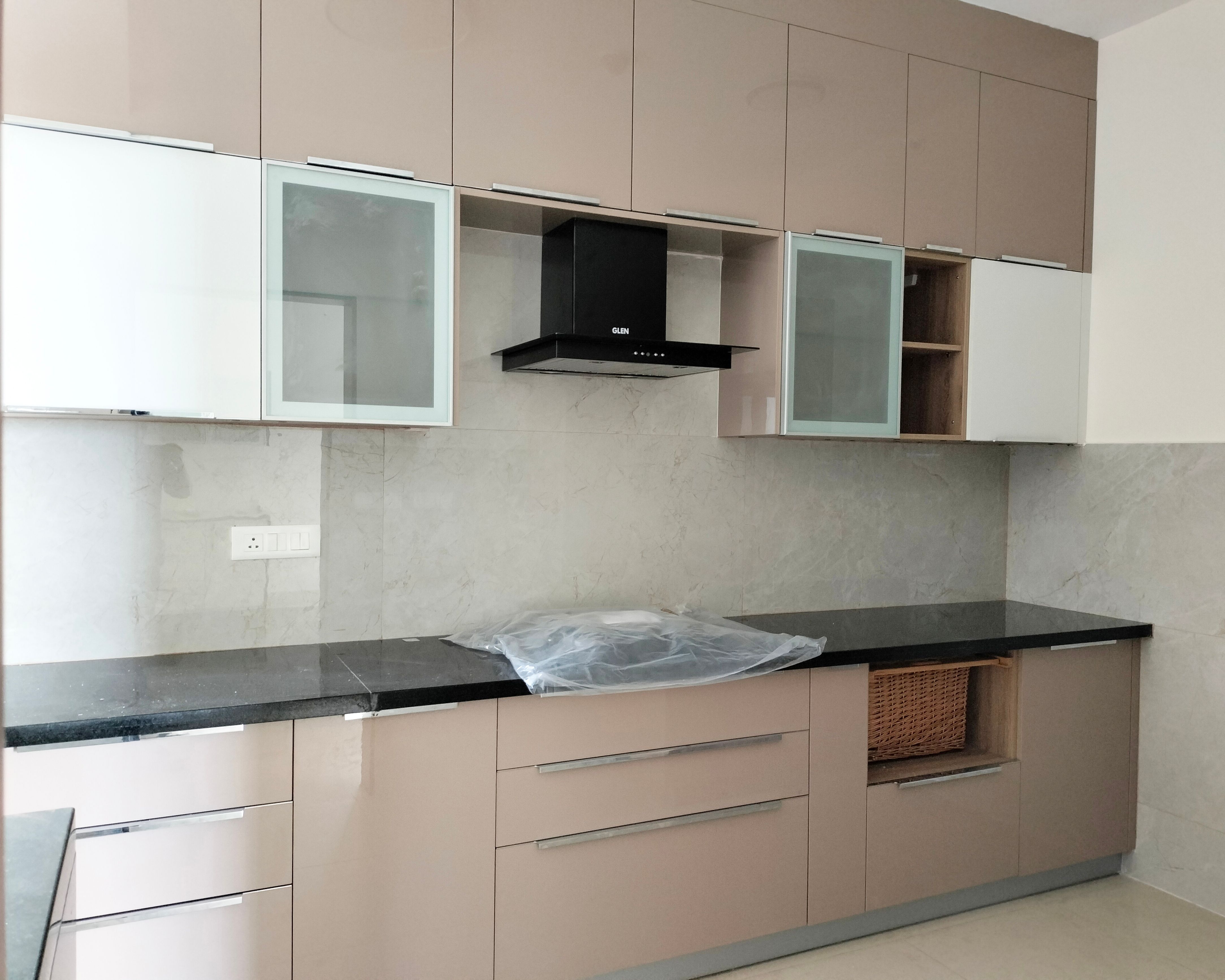 Parallel Kitchen Design with Peach Units and Marble Patterned Backsplash Tile