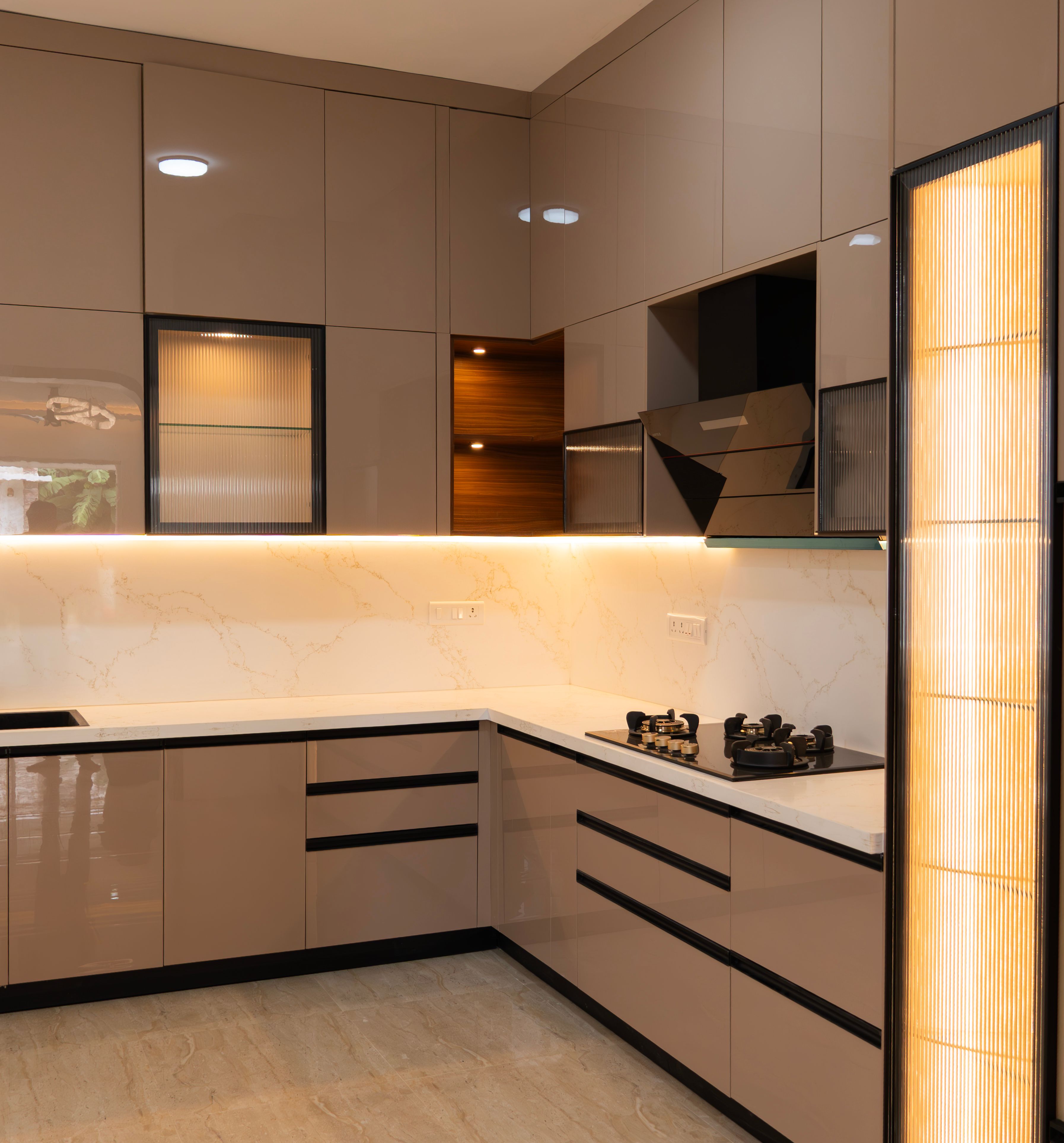L-Shaped Kitchen Design with Beige Cabinets and Marble Backsplash