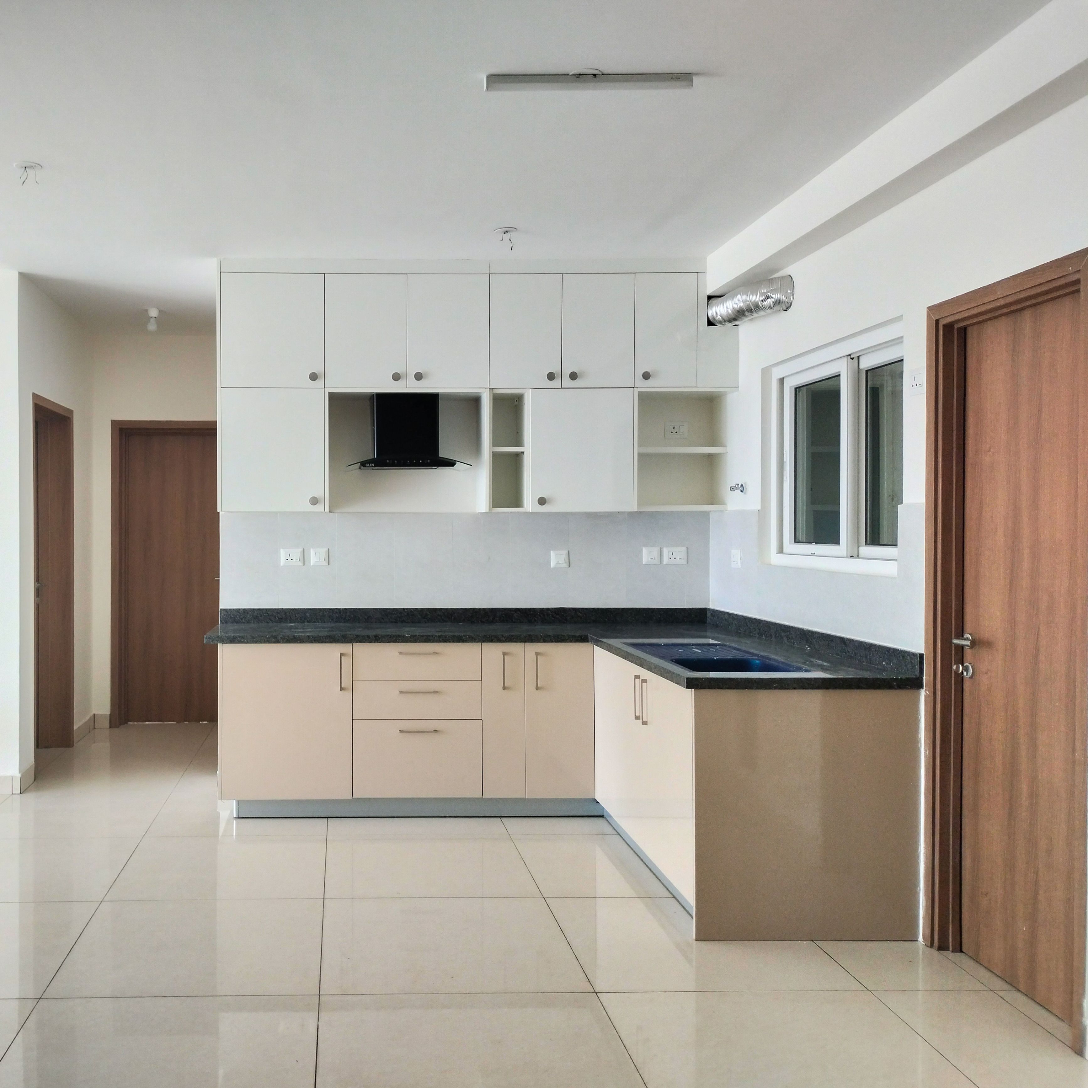 L-Shaped Kitchen Design with Cream Base Units and White Wall Units