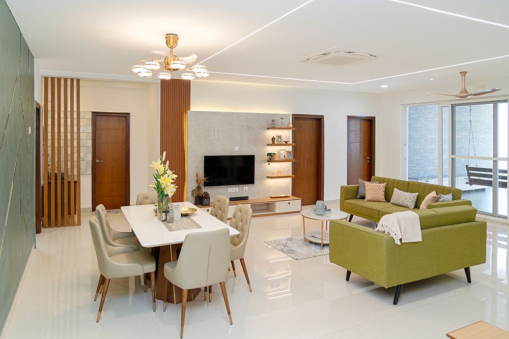 Living Room Design with Green Sofas, 6-Seater Dining Table and TV Unit