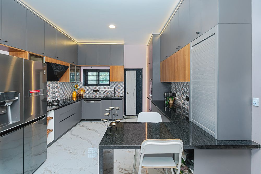 U-Shaped Kitchen Design with Grey Units and Black Granite Countertop