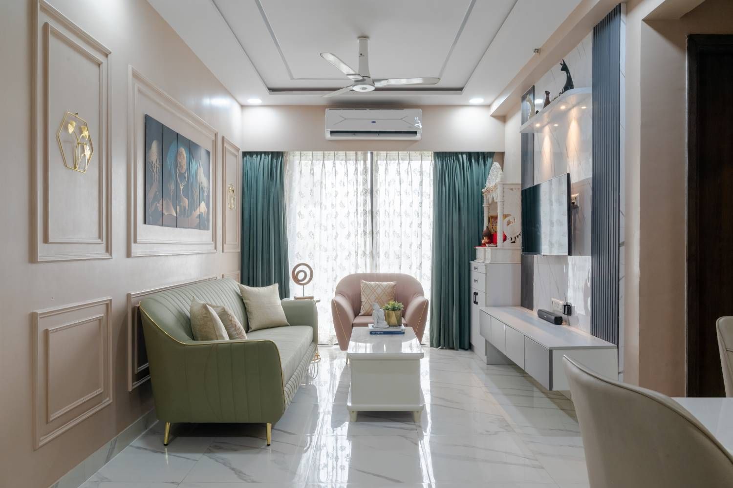 Living Room Design with Green and Pink Sofas, Cream Wall with Trims and TV Unit