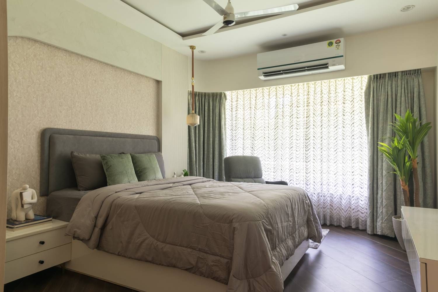 Bedroom Design with Beige Textured Wall, Grey Accent Chair and Grey Tufted Headboard Bed
