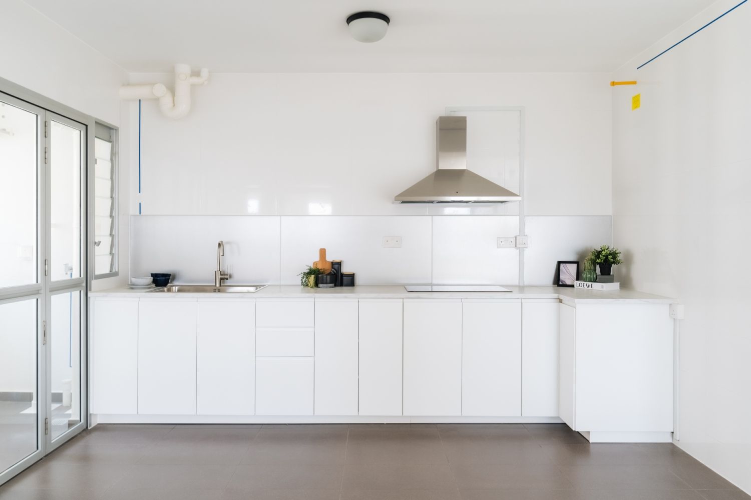 Minimal Kitchen Design With White Closed Storage Cabinets
