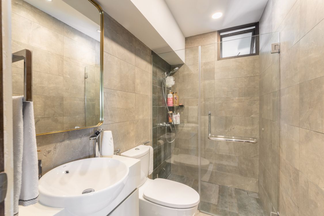 Modern Bathroom Design With Brown Tiles And Champagne-Coloured Laminates