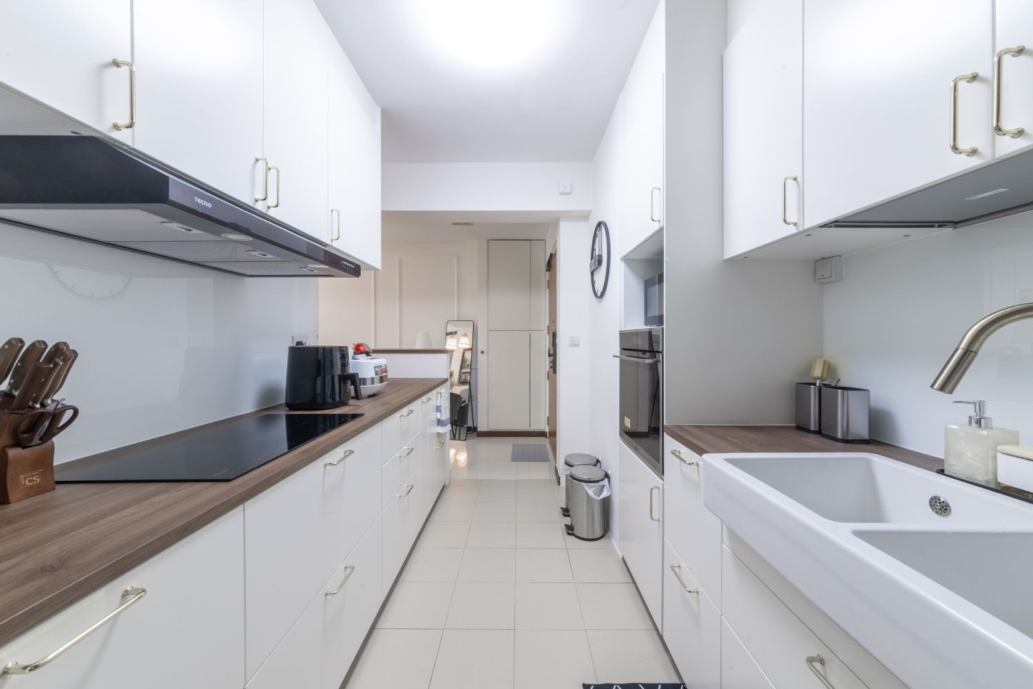 Modern Parallel Kitchen Design With A Wooden Countertop