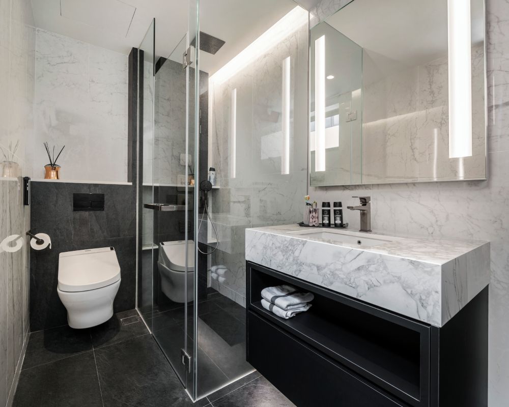 Compact Bathroom Design With A Glass Shower Cubicle | Livspace