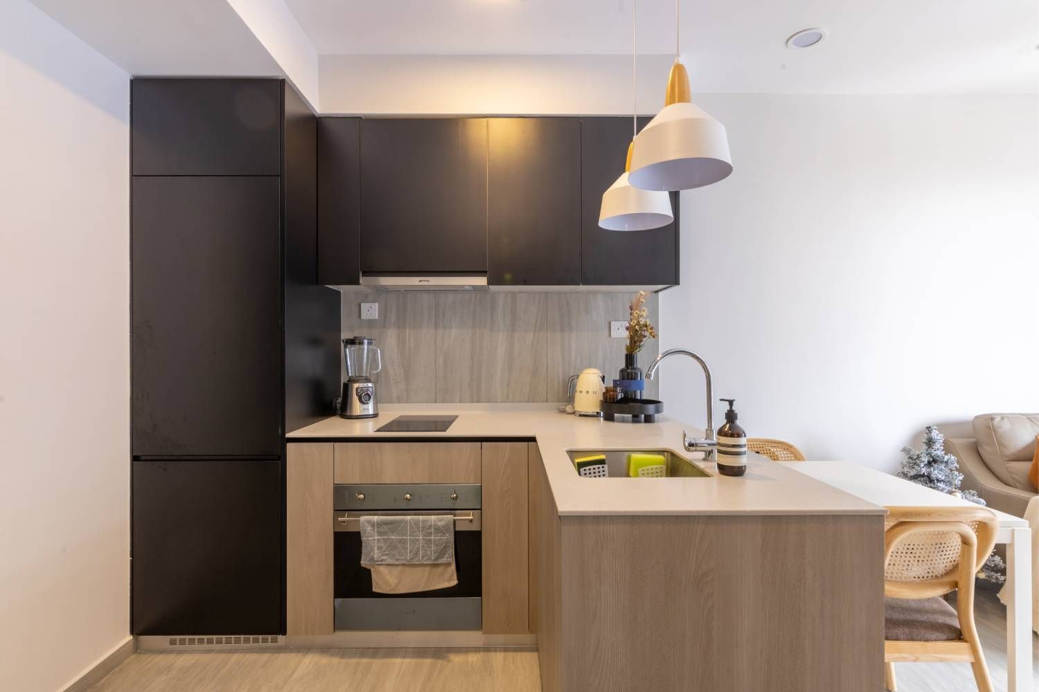Contemporary Compact L-Shaped Kitchen in Wood with Black Tall Unit and Wall Storage