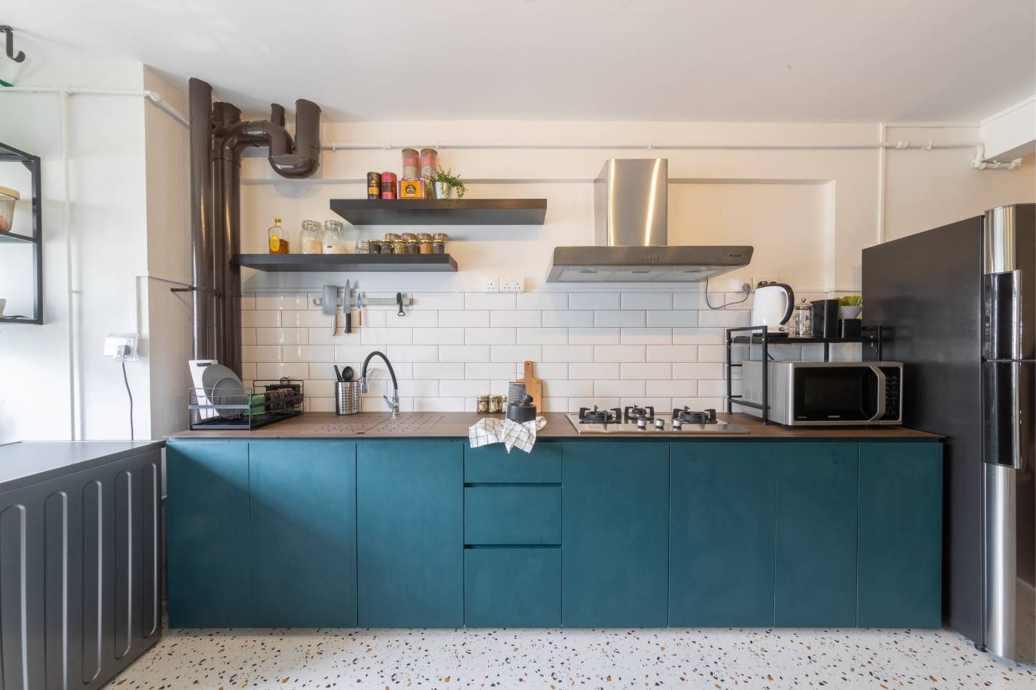 Contemporary Straight Kitchen with Teal Cabinets and White Subway Tiles