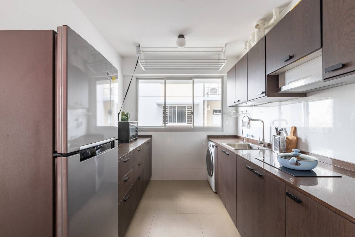 Contemporary Parallel Kitchen Interior Design with Dark Wooden Cabinets and Granite Countertop