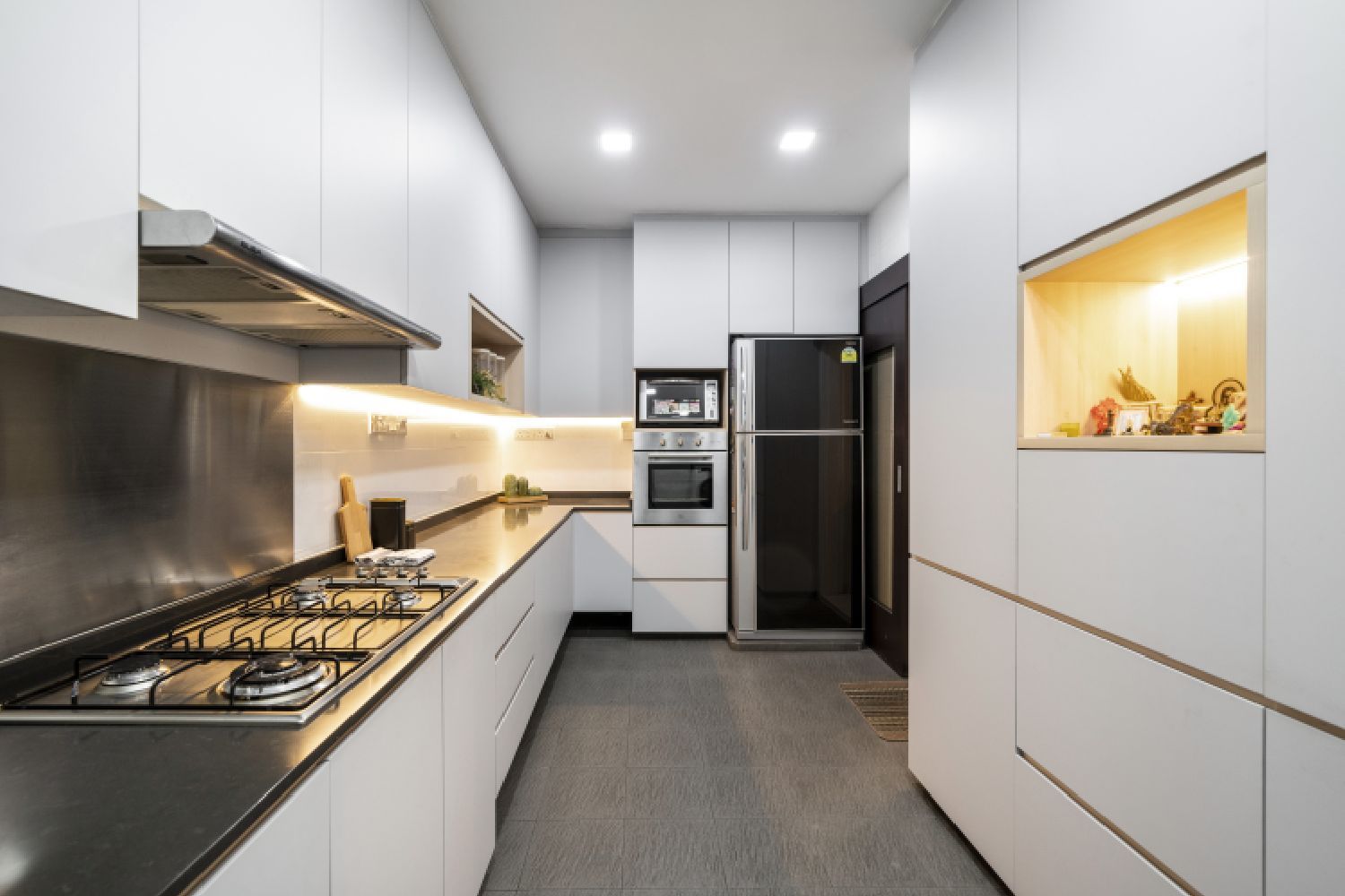 Spacious Parallel Kitchen Design With White Kitchen Cabinets And Black ...