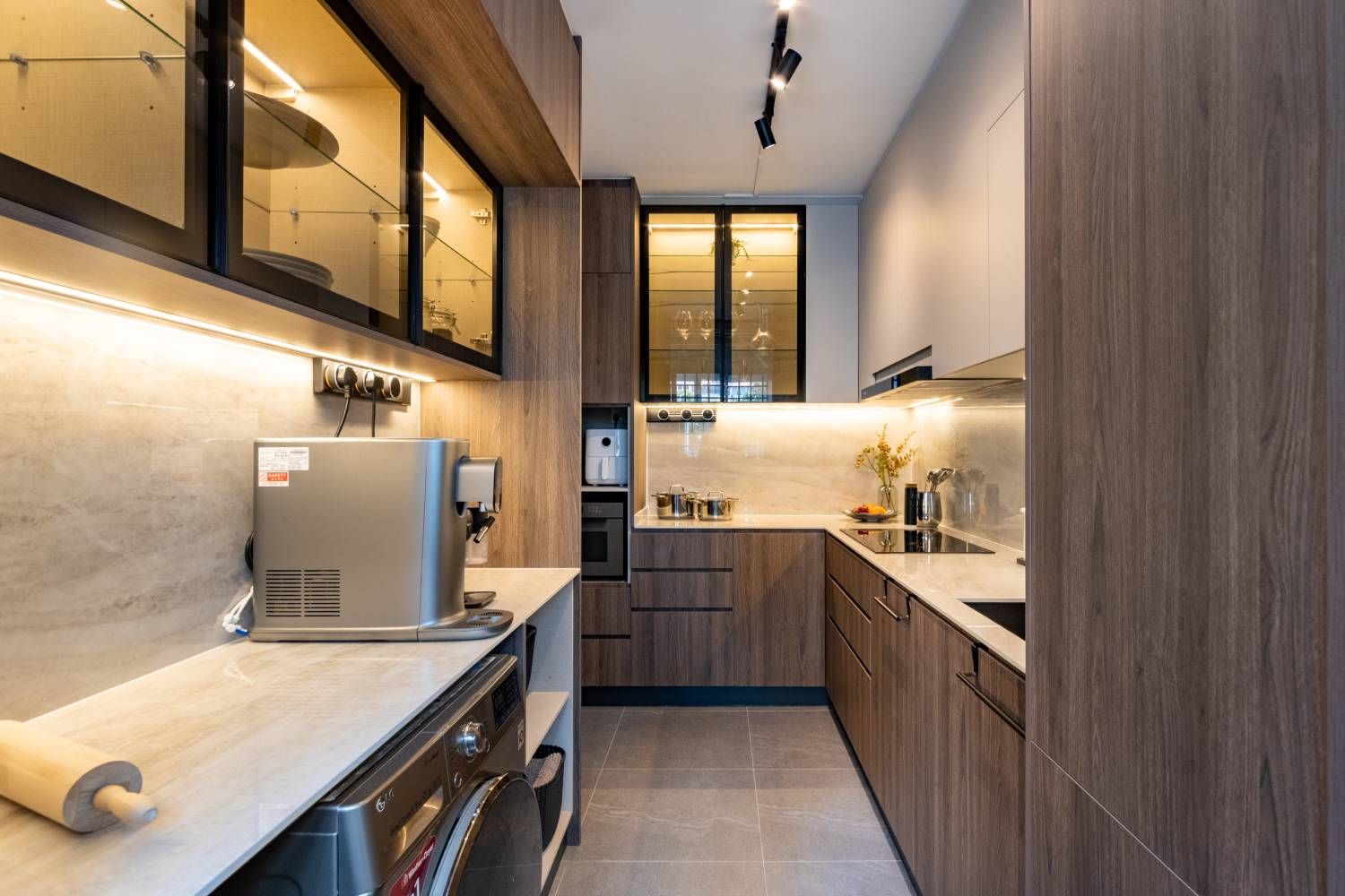 Parallel Brown And Cream Kitchen Design With Profiled Glass Wall | Livspace