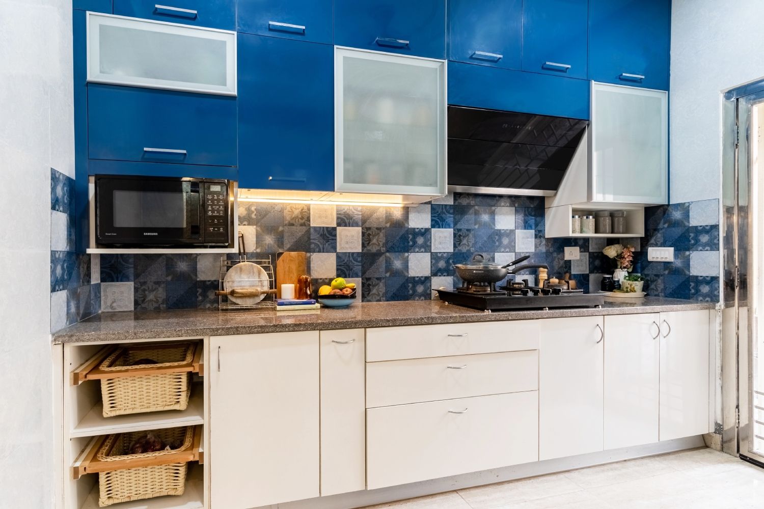 Modern Indian Kitchen Design With Spacious White And Blue Kitchen Cabinets