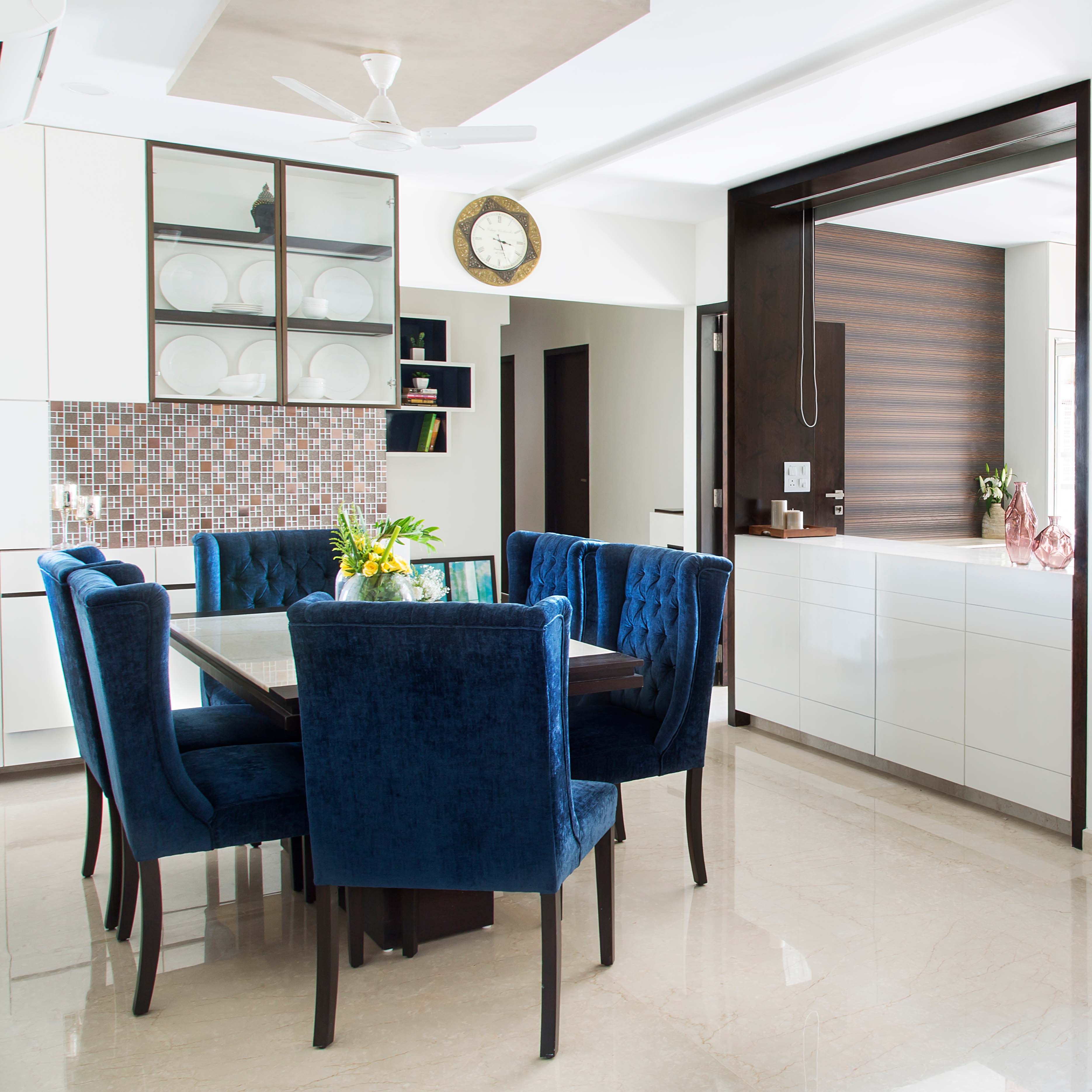 Contemporary 6-Seater White And Dark Blue Dining Room Design With White Crockery Unit