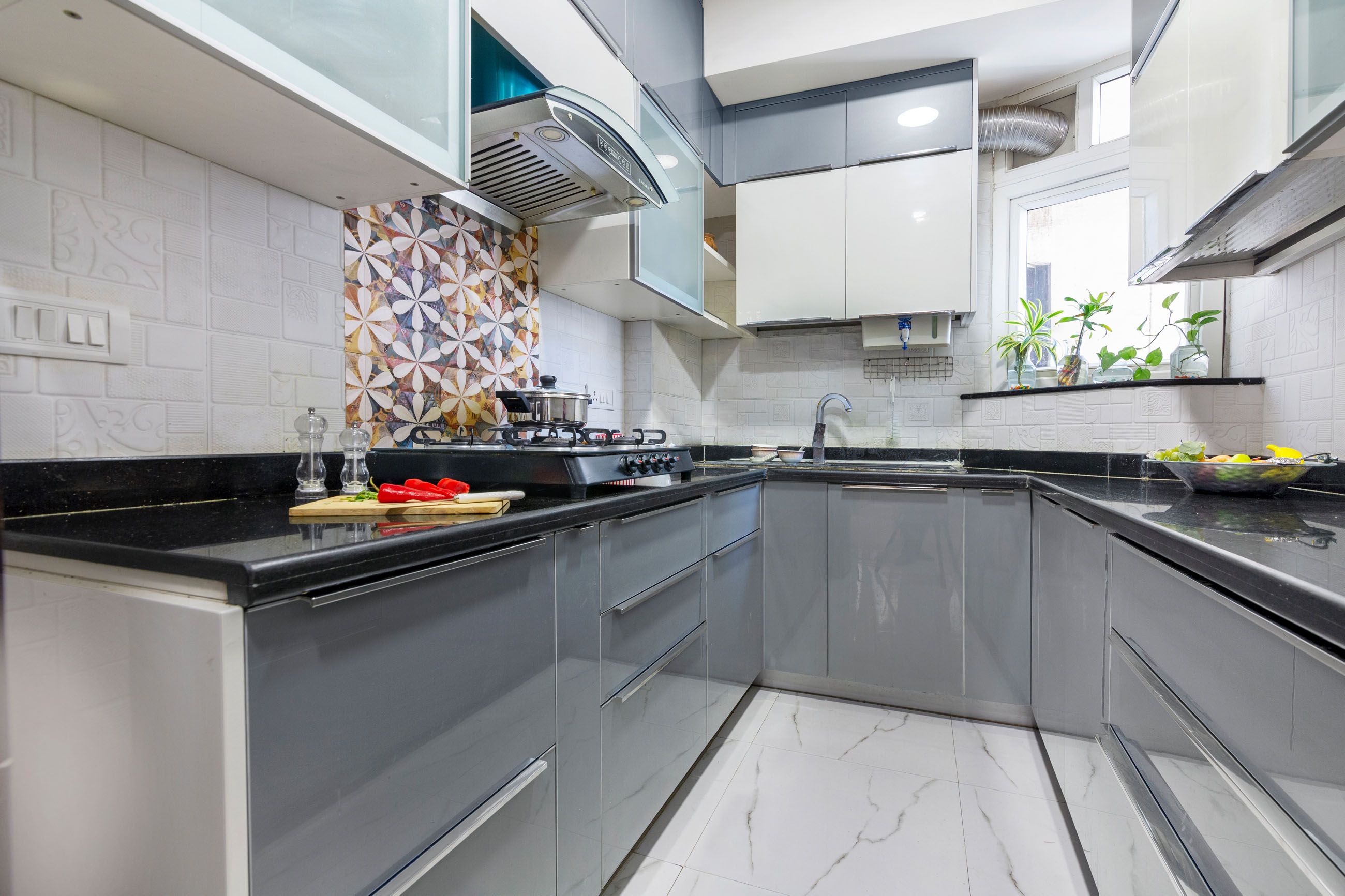 Contemporary Modular U-Shaped Grey And White Kitchen Design WIth 3D Floral Multicoloured Kitchen Tiles