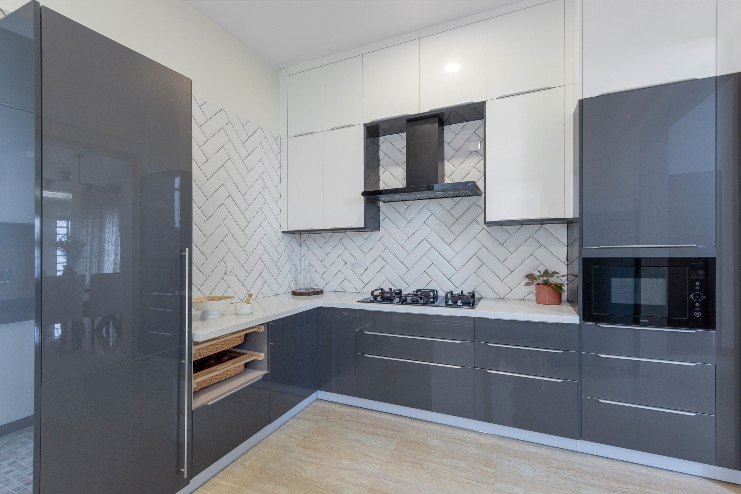 Contemporary Modular Glossy L-Shaped Kitchen Design With White Herringbone Backsplash