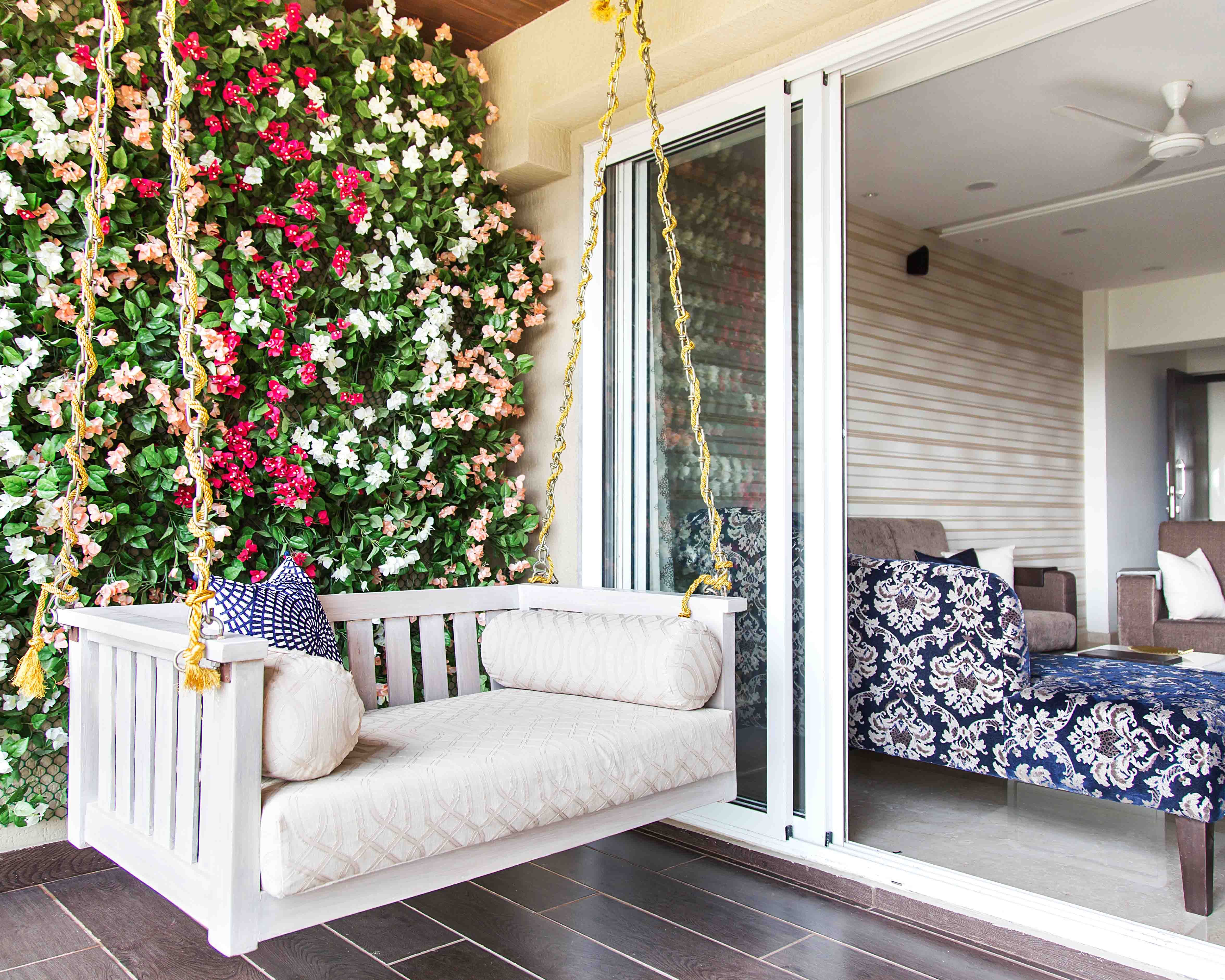 Modern Balcony Design with Wall Planter and White Swing