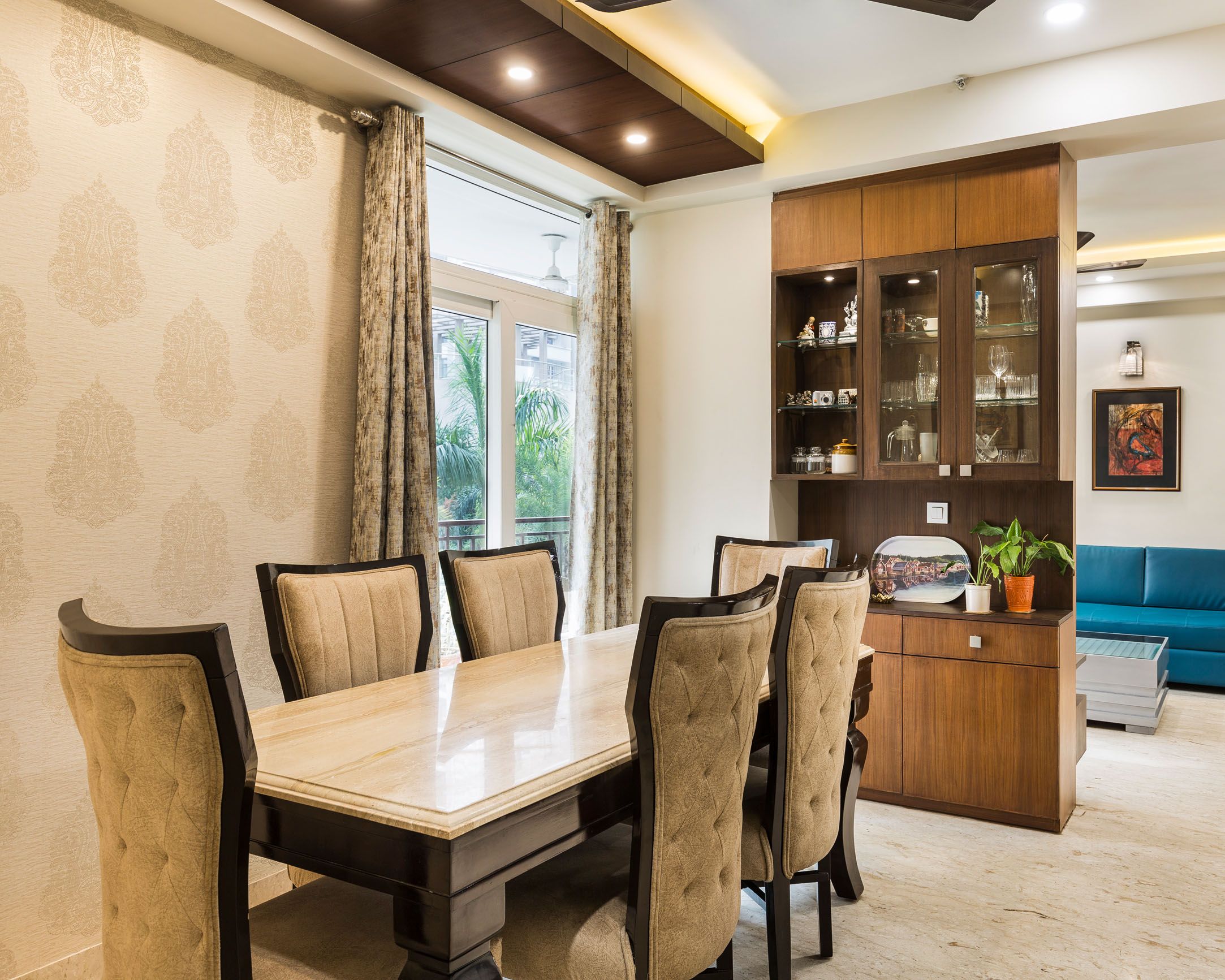 Modern Beige 6-Seater Dining Room Design With Wooden Crockery Unit