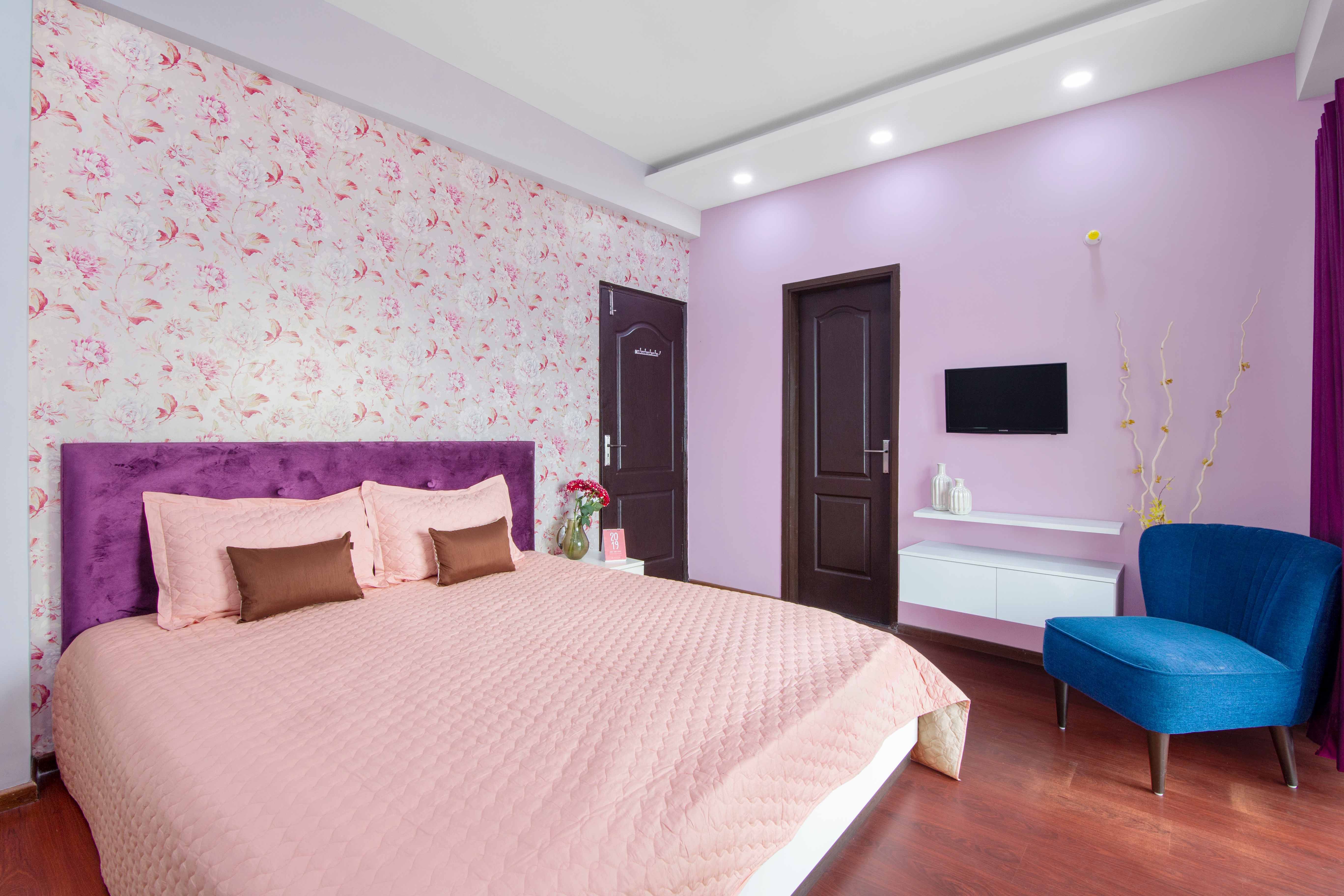 Contemporary Pink And Purple Guest Room Design With Floral Wallpaper