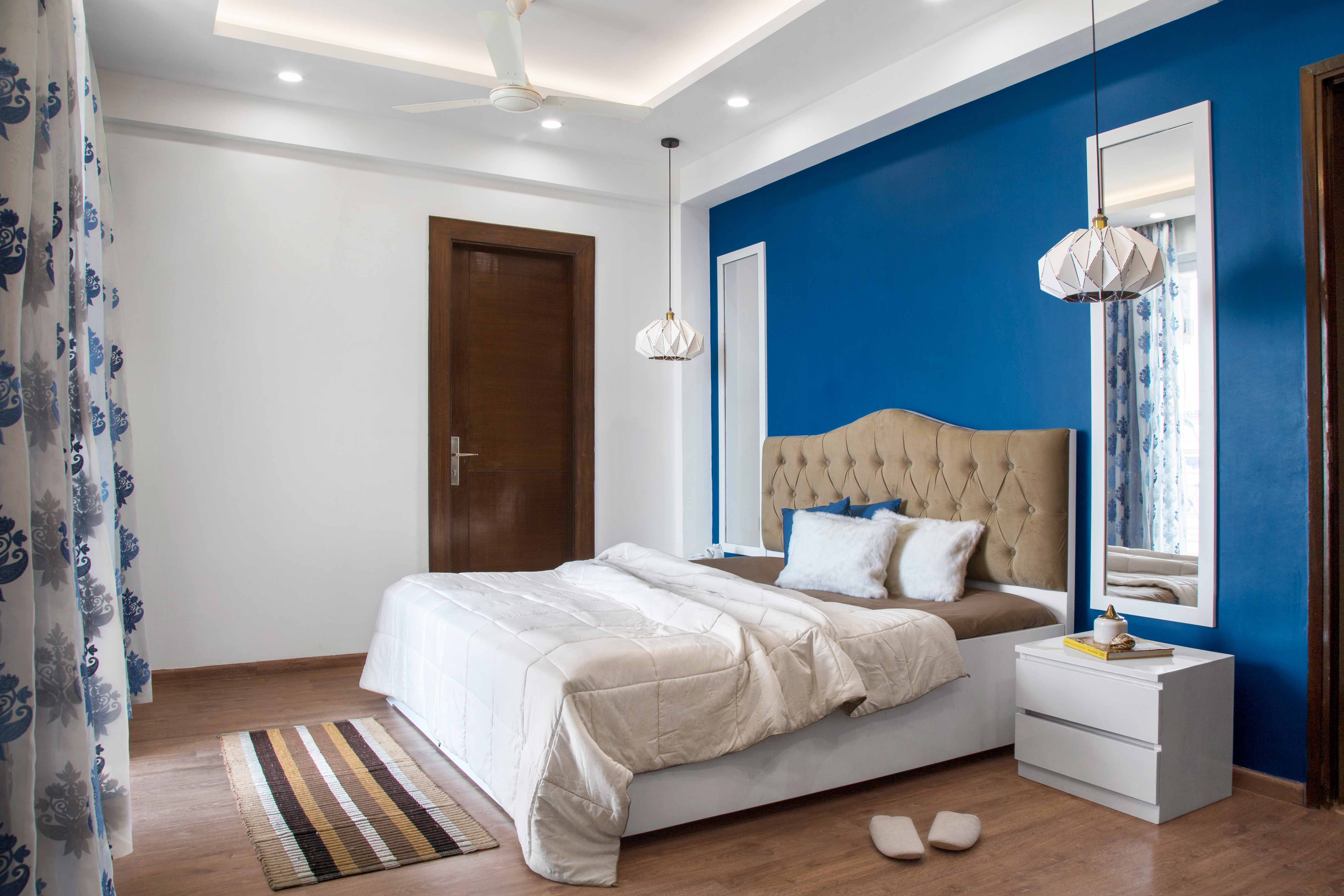 Classic Guest Room Design With Blue Accent Wall