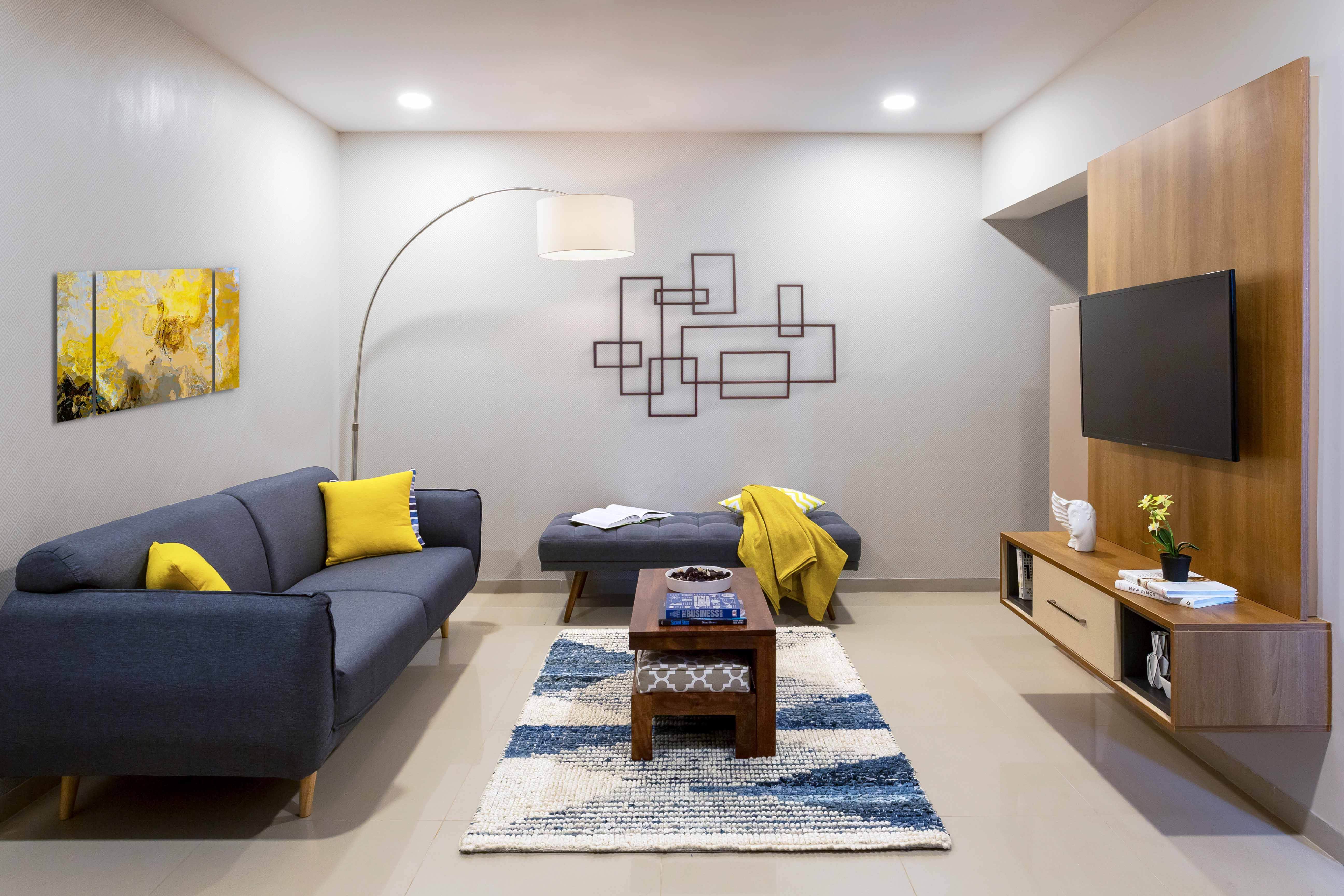 Classic 2-BHK Flat In Bangalore With Minimalistic Blue And Brown Living Room Design
