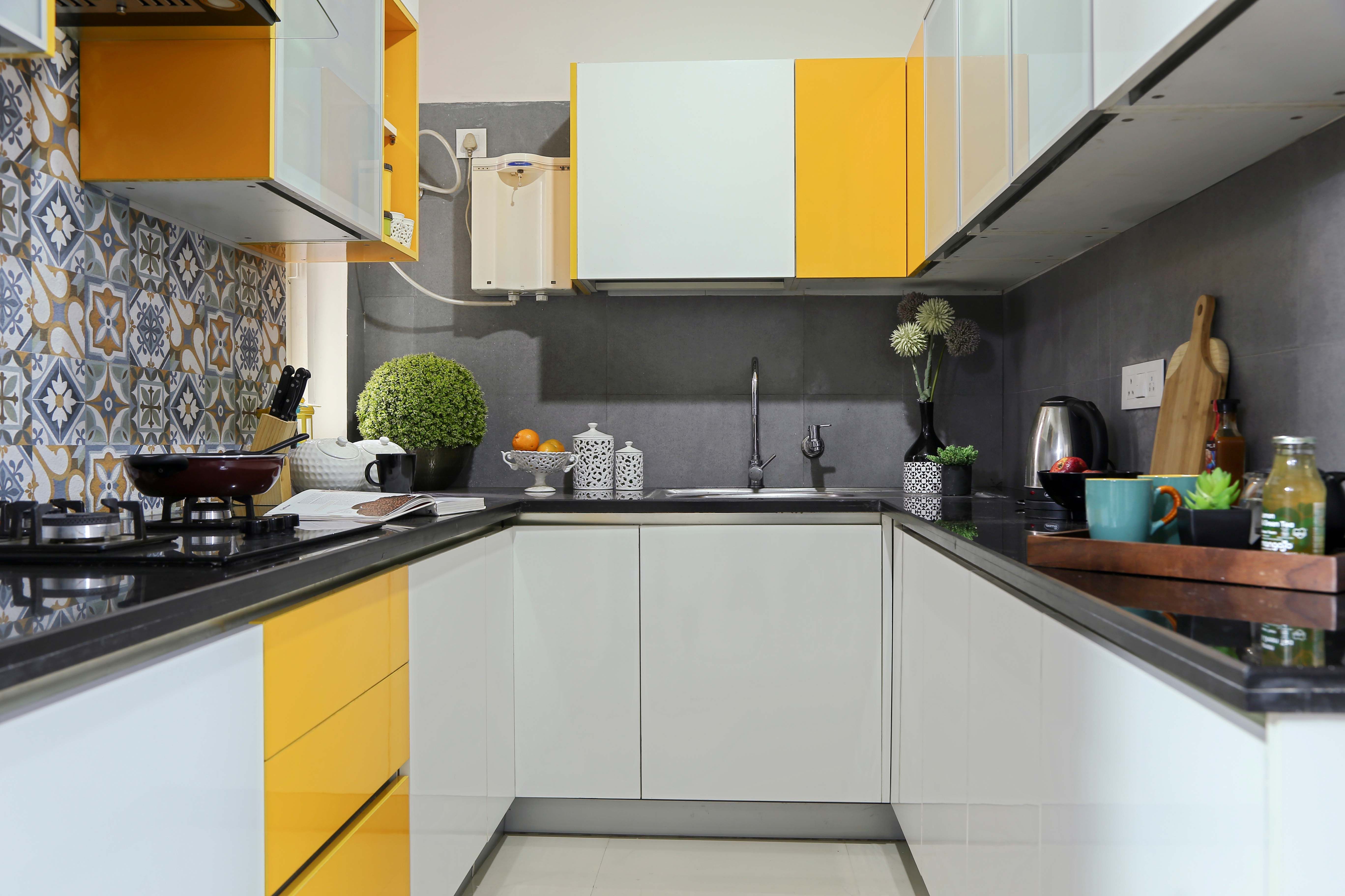 Modern U-Shaped Modular Kitchen Design with Frosty White and Marigold Accents