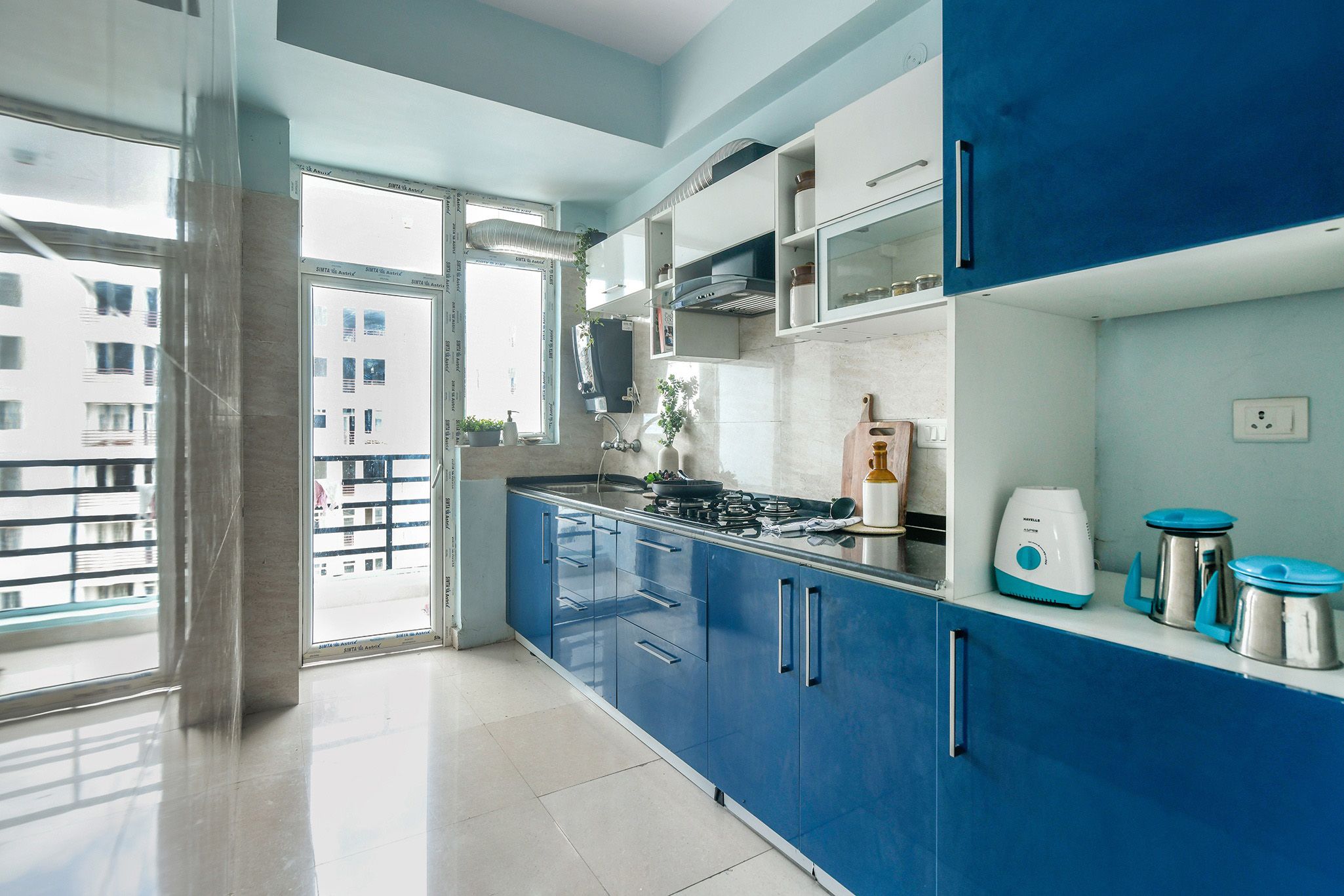 Traditional India Kitchen Design with Kingfisher Blue Base and Tall Units