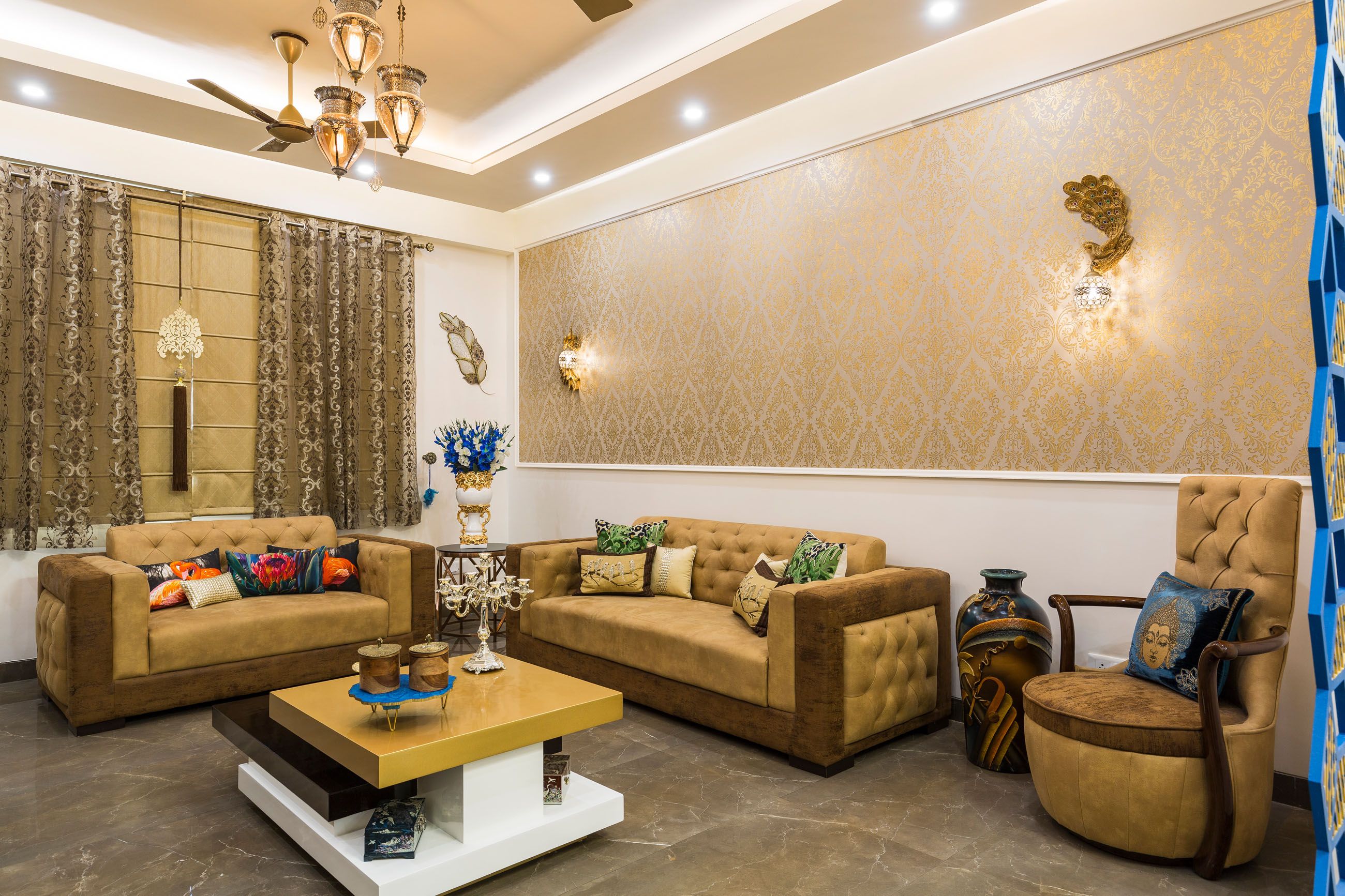 Traditional Gold-Toned Living Room Design With Beige And Brown Sofas And Damask Wallpaper