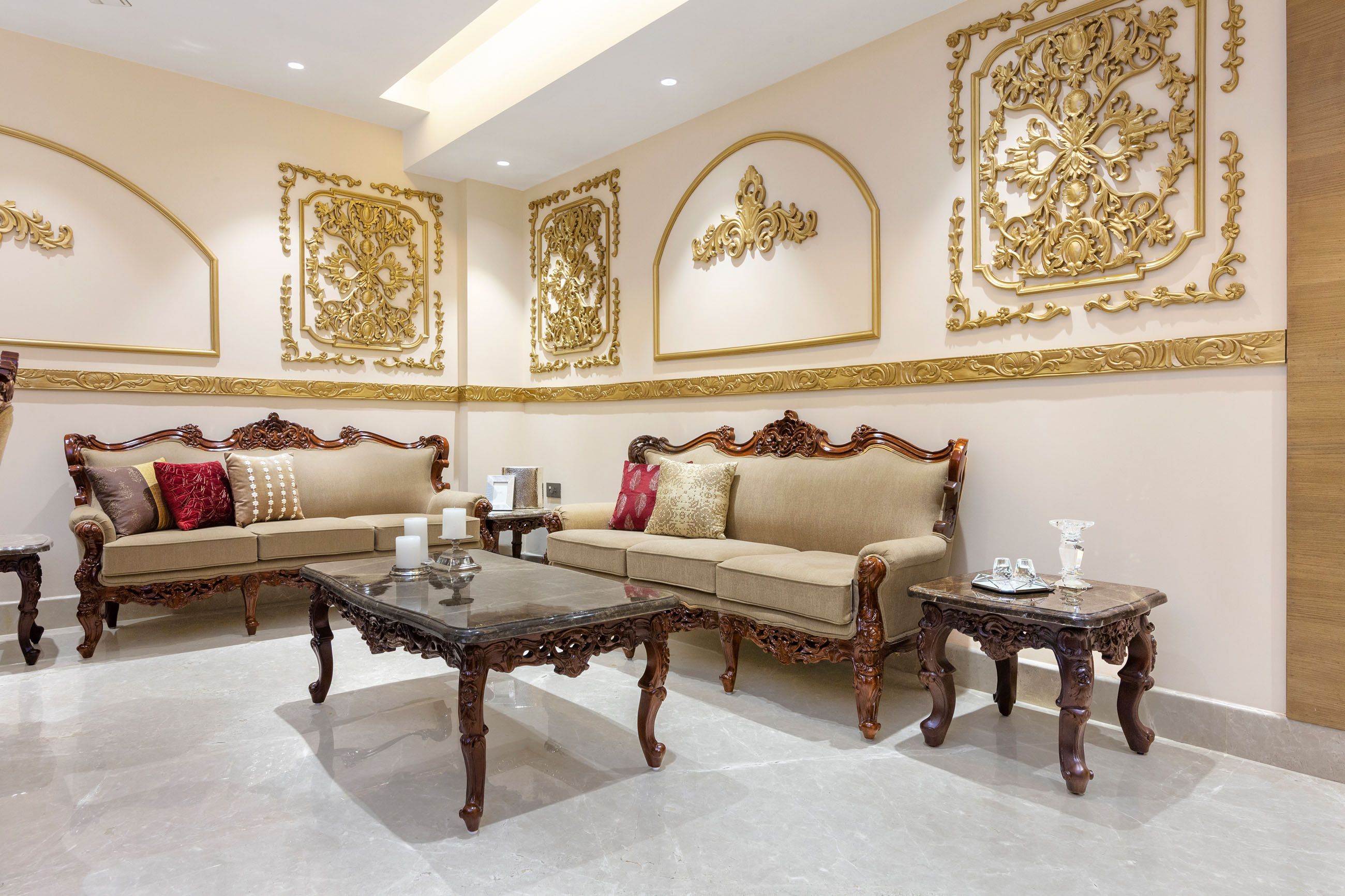 Traditional Living Room Design With Ornamental Gold-Toned Wall Moulding