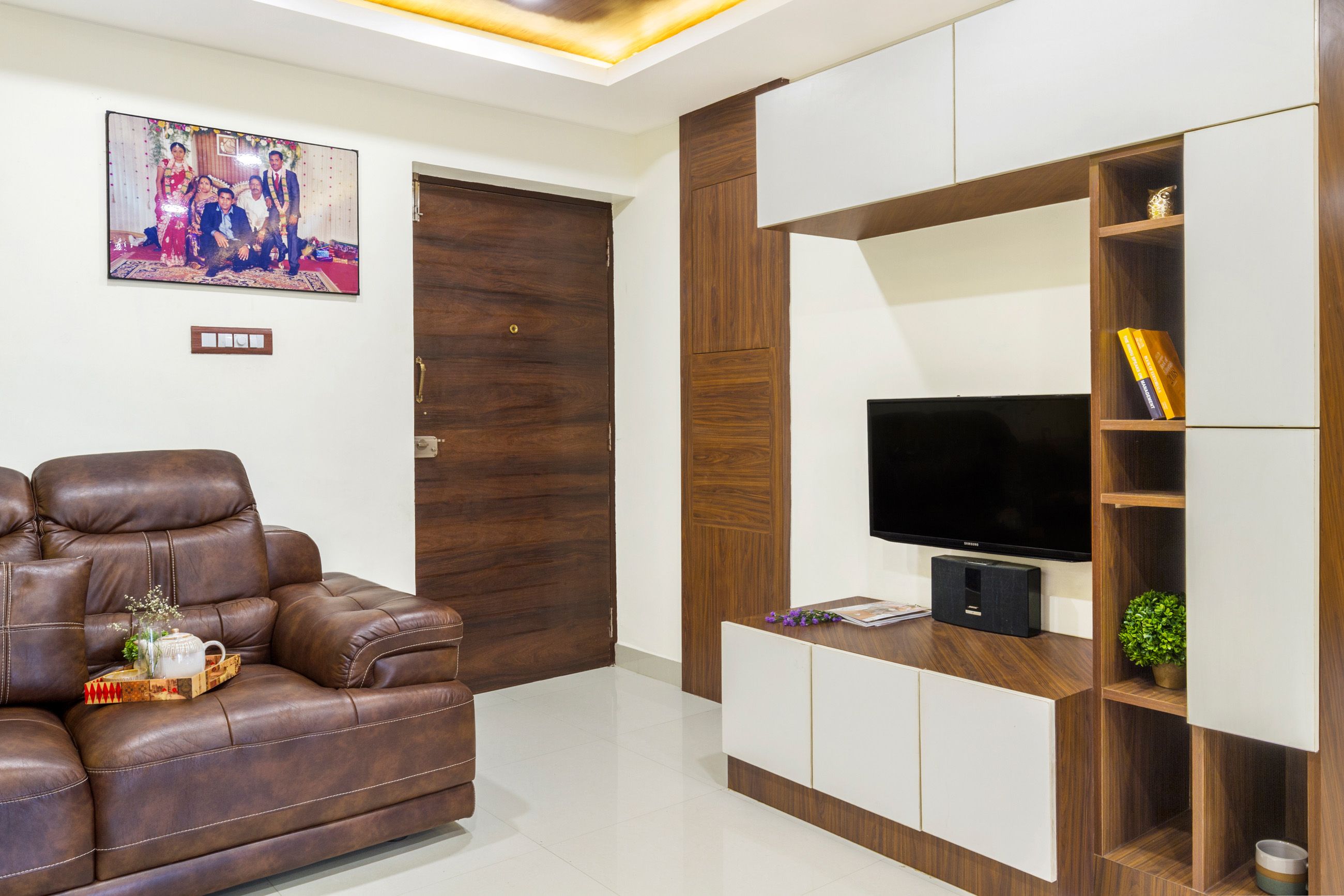 Modern White And Wood TV Unit Design With Laminates In Suede Finish