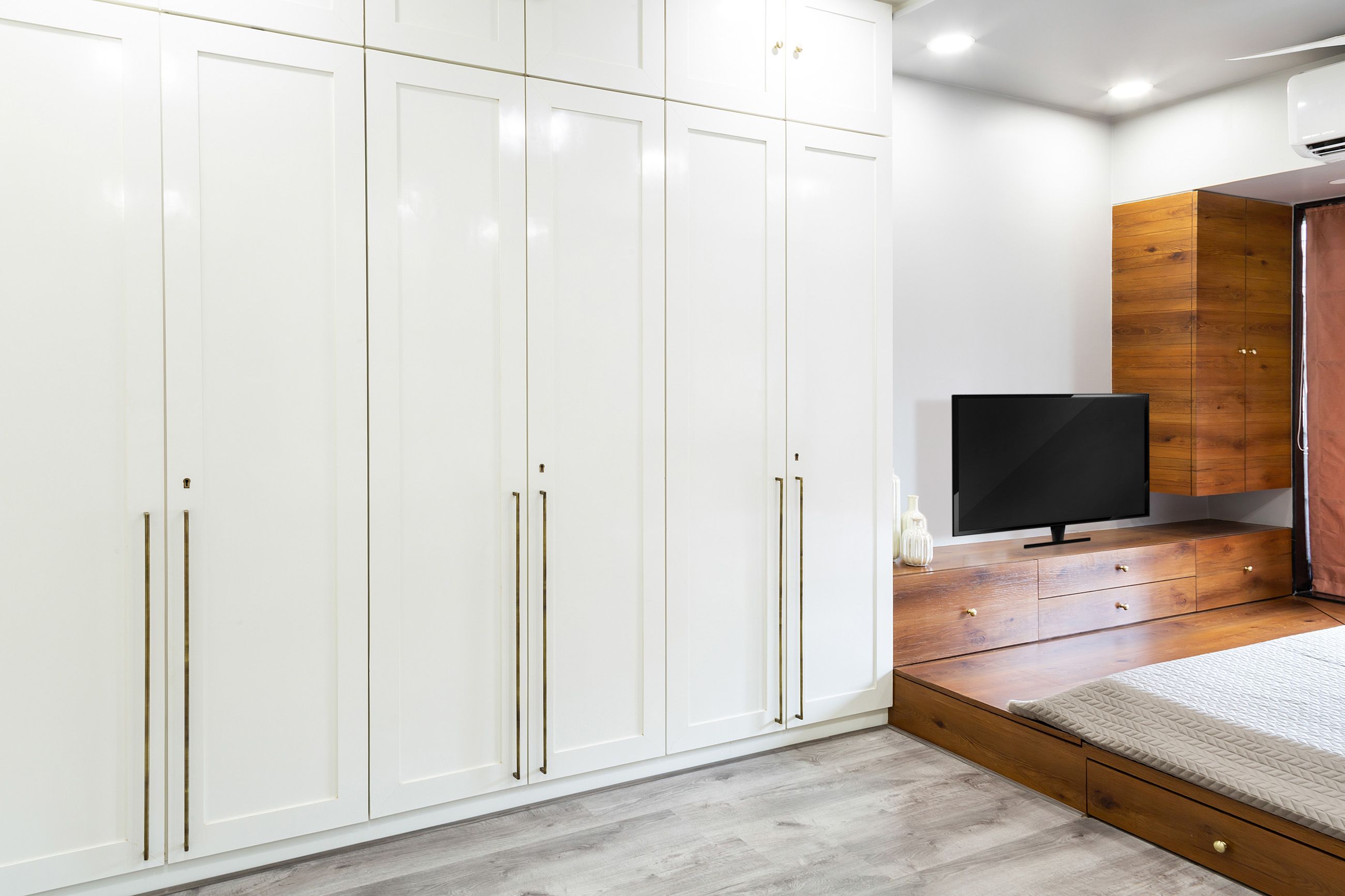 Modern White 6-Door Swing Wardrobe Design With Loft Storage