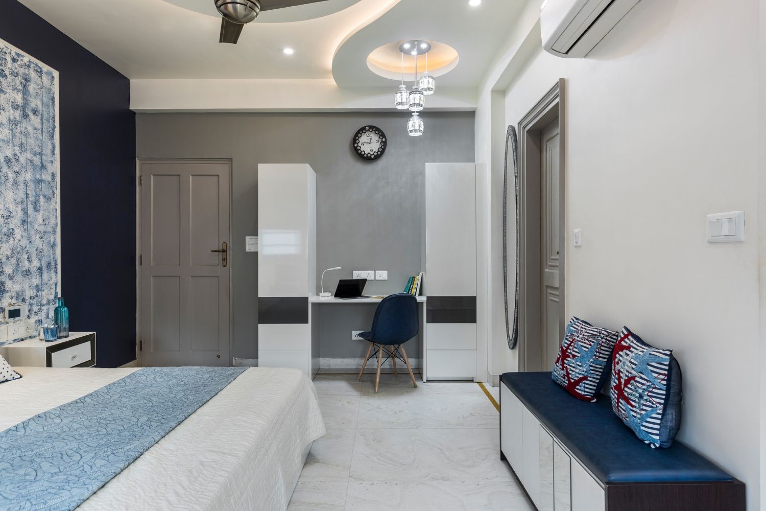 Modern Multilayered Bedroom False Ceiling Design With A Chandelier