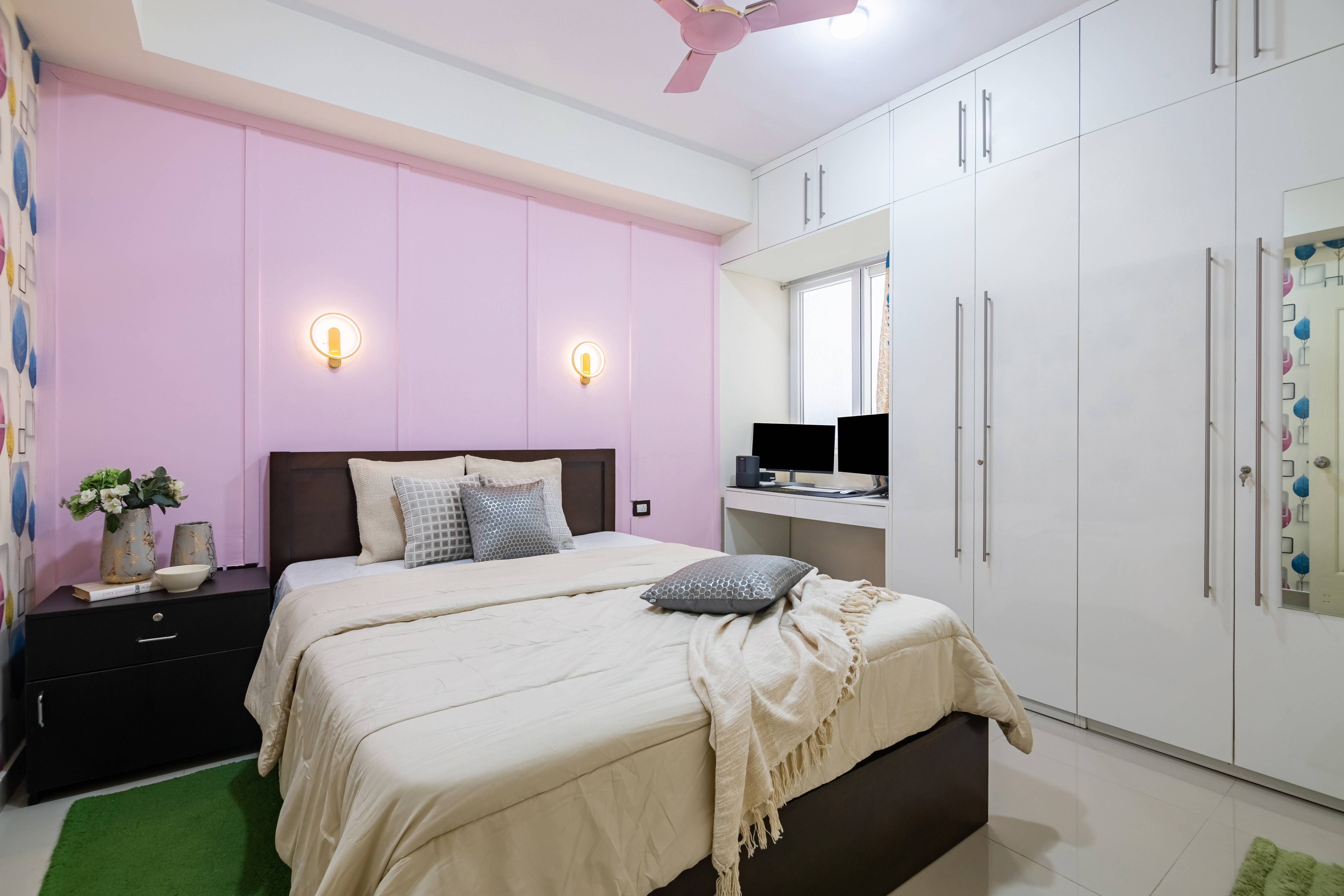 Spacious Guest Bedroom Design With Baby Pink Accent Wall And White