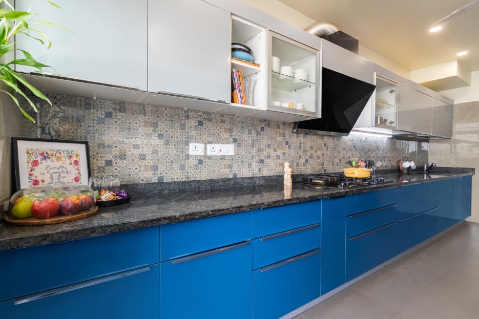 Modern Parallel Kitchen Cabinet Design With A Wide Blue Base Unit With Drawers