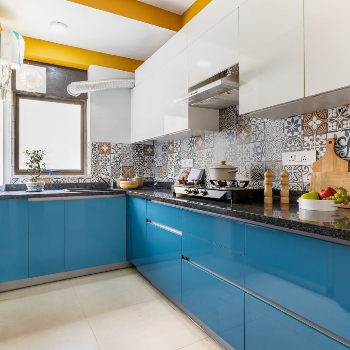 Modern U-Shaped Kitchen Design With Blue And White Cabinets