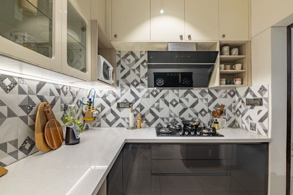 Contemporary L-Shaped Kitchen Design With Patterned Dado Tiles