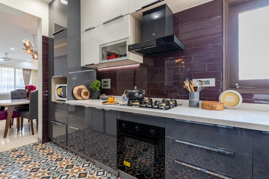 Modern L-Shaped Kitchen Design With Glossy Purple Subway Dado Tiles