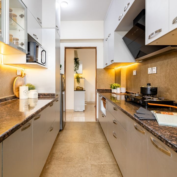 Modern Parallel Modular Kitchen Design With White And Beige Storage Units