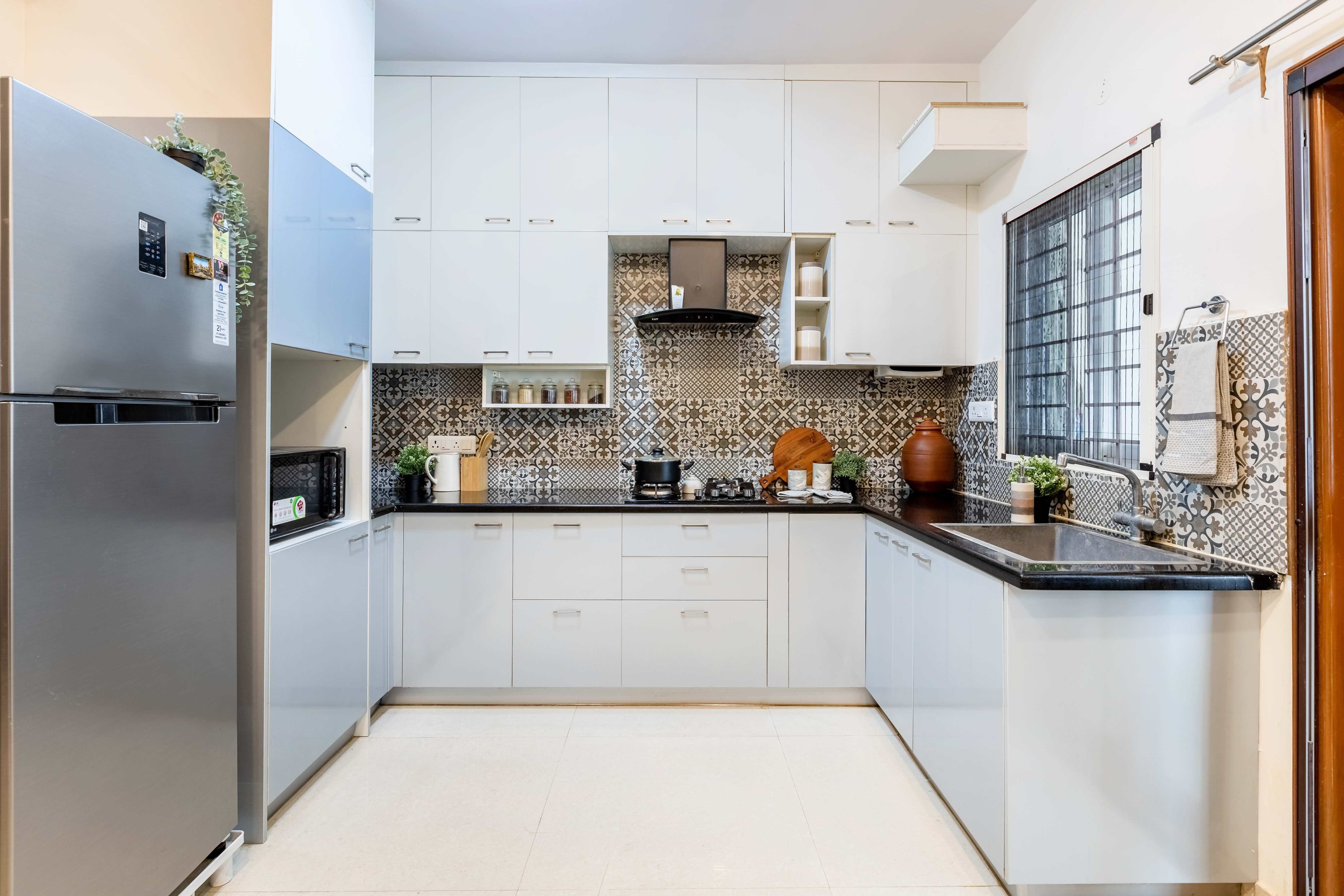 Spacious Modular Kitchen Design With Light Blue And White Storage Units Livspace 