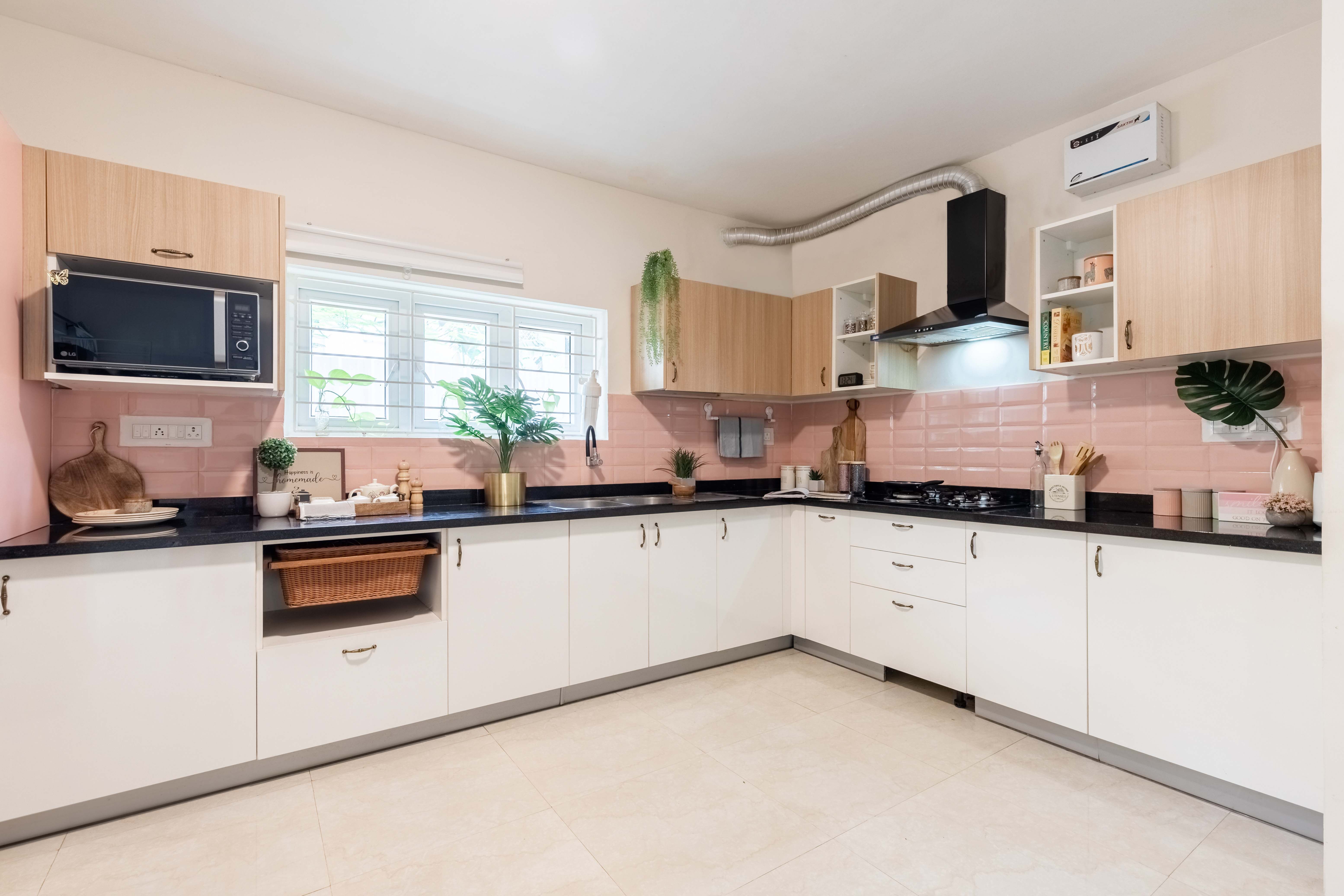 Modern L-Shaped Kitchen Design With Pink Backsplash Tiles