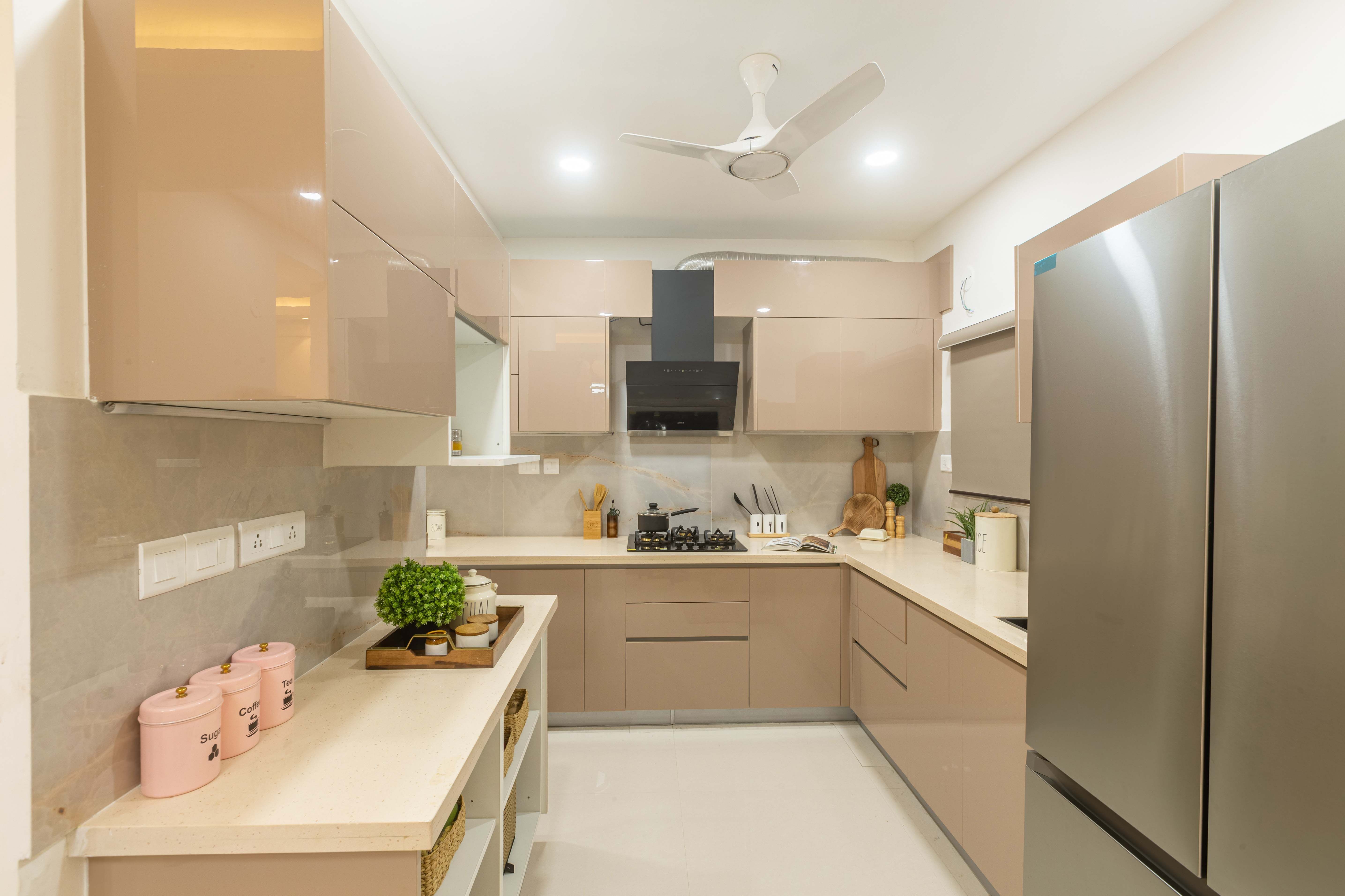 Modern L-Shaped Kitchen Design With Metallic Beige Cabinets