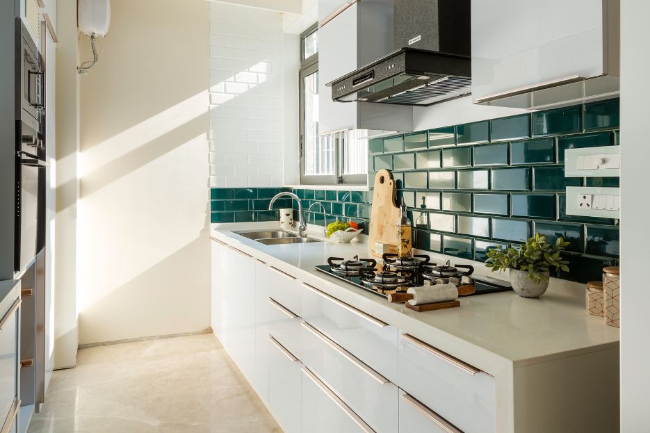 Contemporary Parallel Kitchen Design With Turquoise Subway Tiles