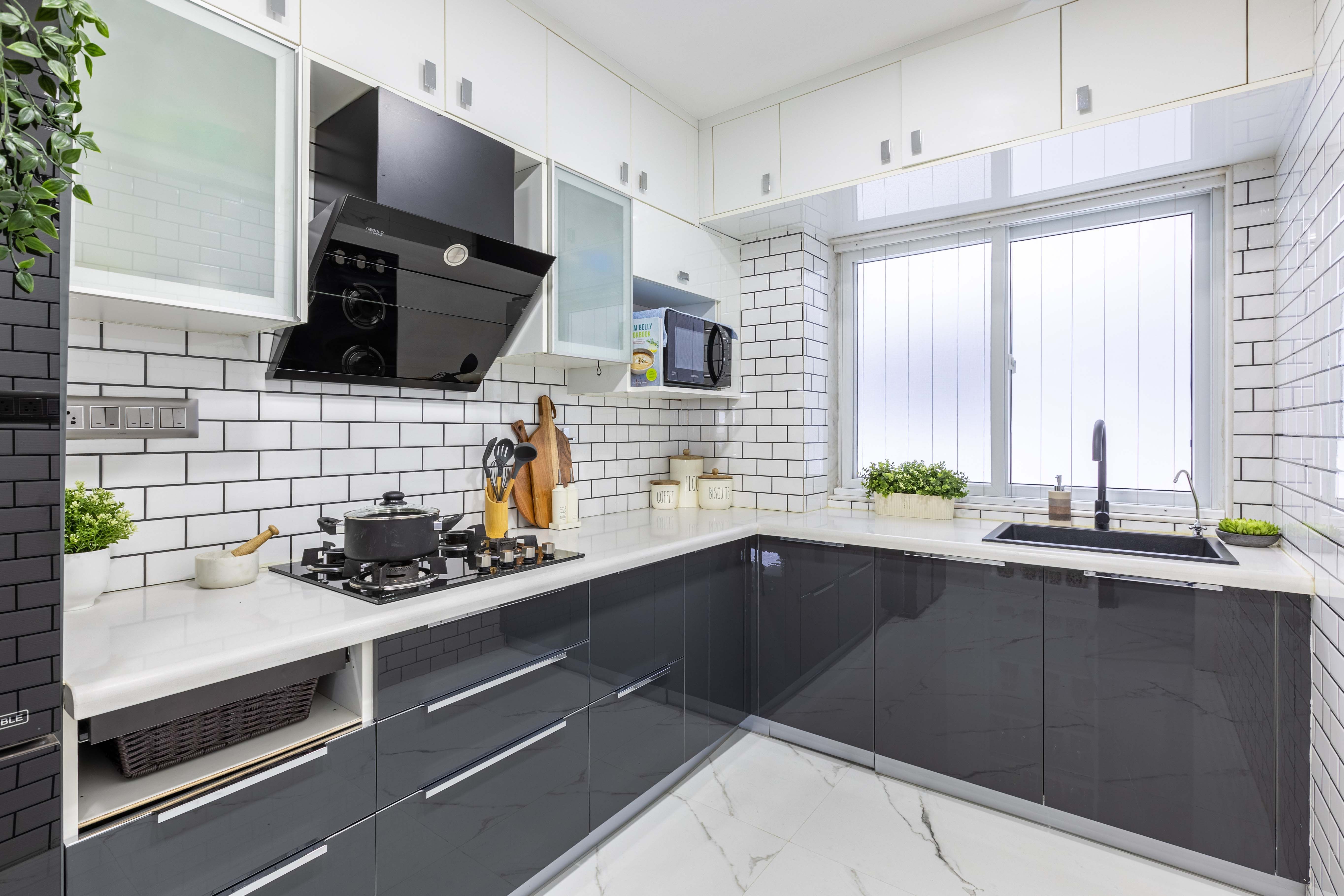 Modern L-Shaped Kitchen Design With Black And White Storage Units