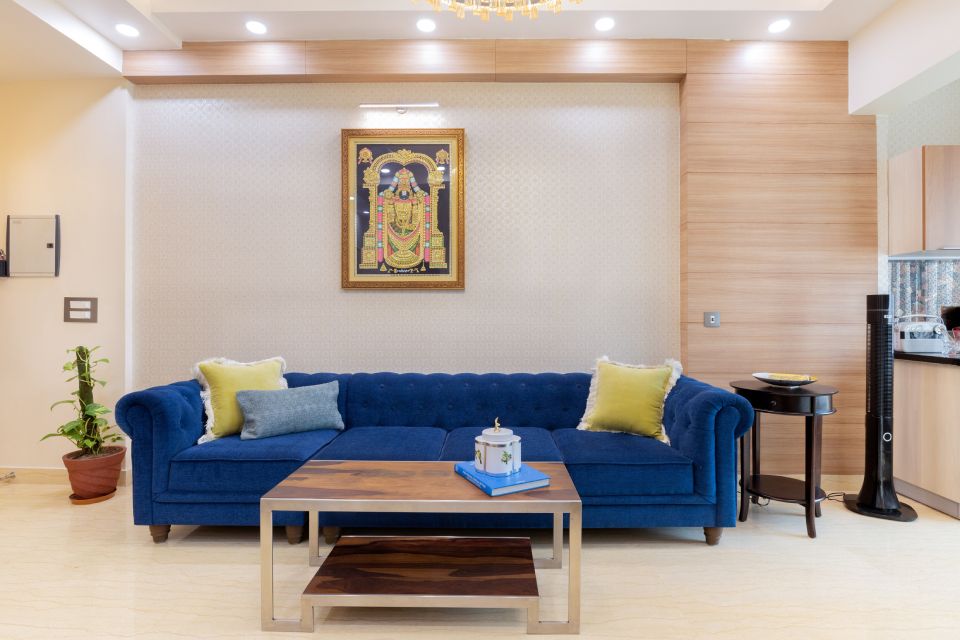 Compact Drawing Room Design With A Blue Tufted Sofa | Livspace