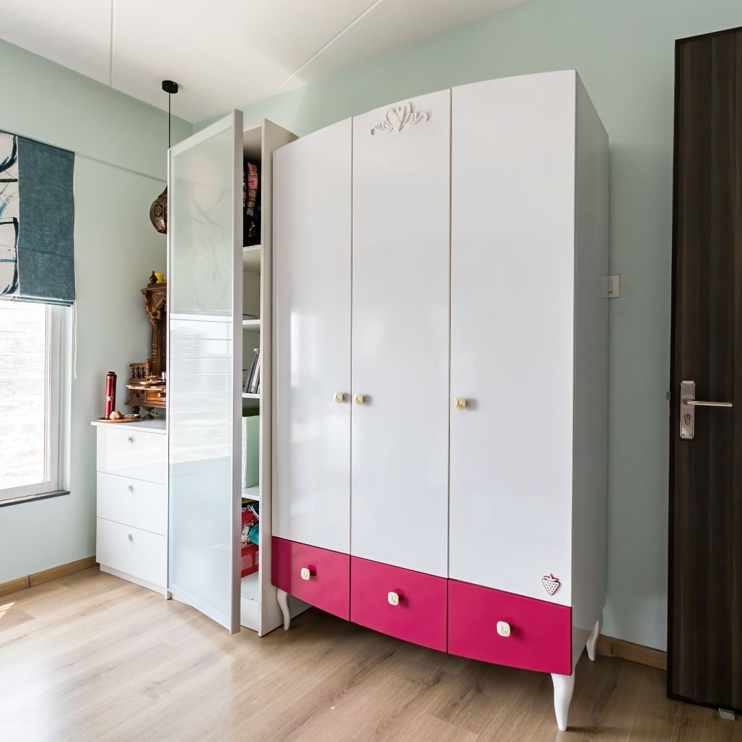 Modern White And Pink 3-Door Swing Wardrobe Design With Frosted Glass Storage Unit And Mandir Unit