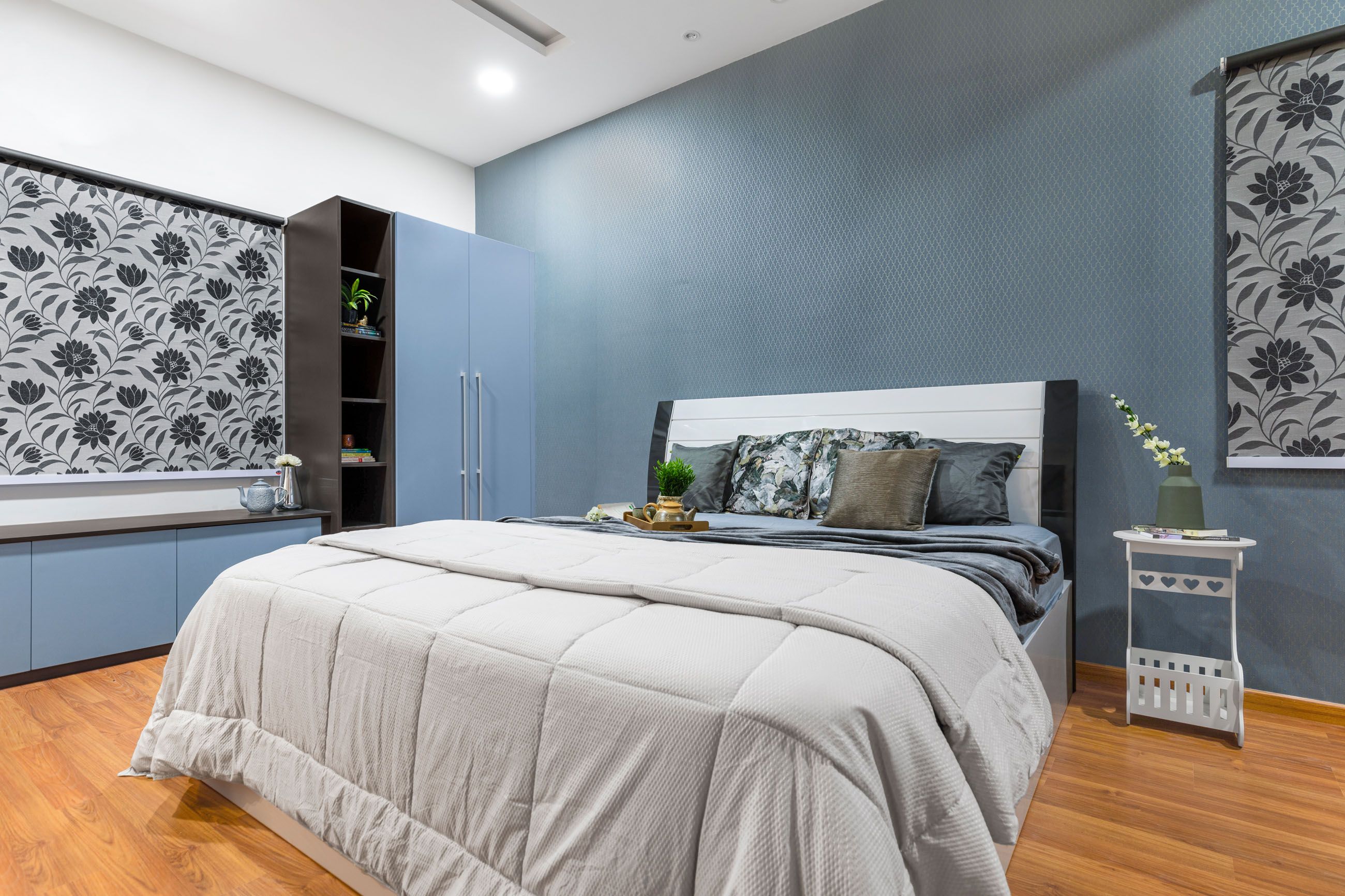 Modern Blue Guest Bedroom Design With Patterned Wallpaper And 2-Door Swing Wardrobe